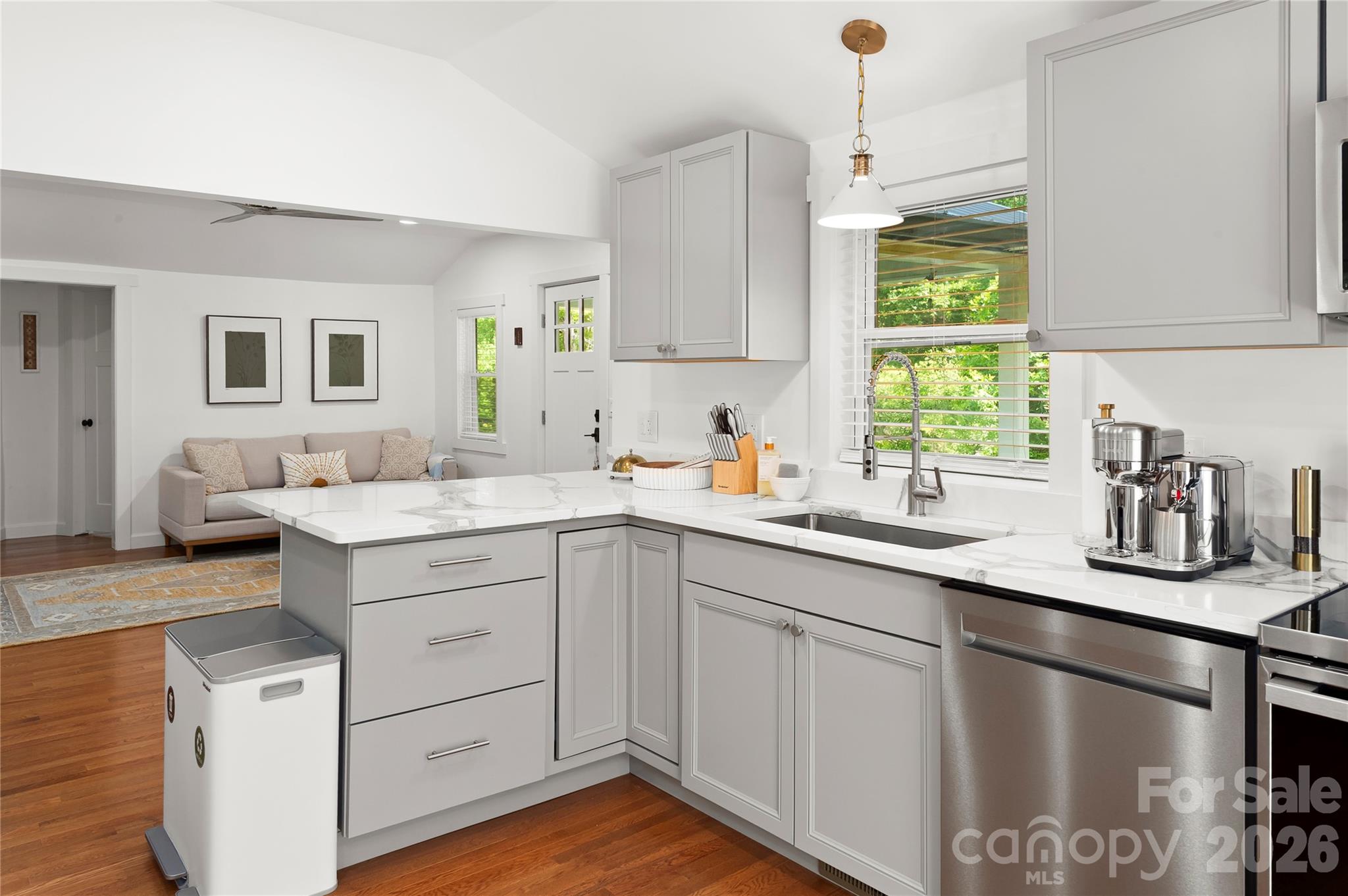 Kitchen looks out on the living room with sink window looking out on the spacious front lawn. - 121 Sugar Cove Road, Weaverville