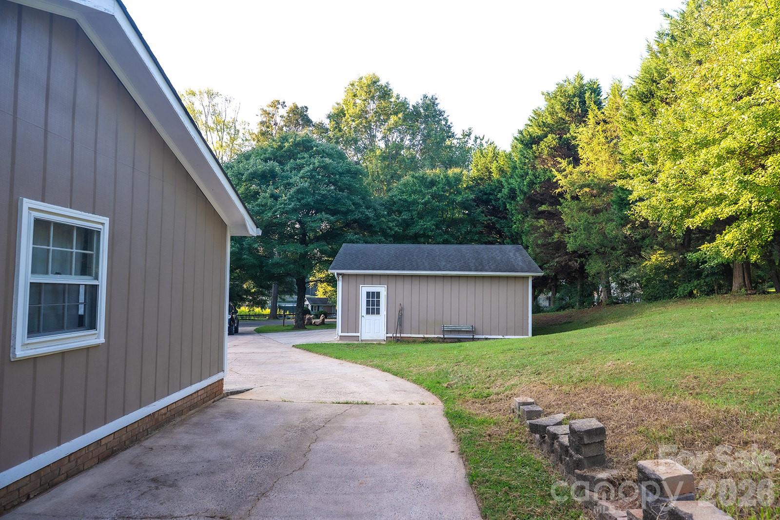 Parking spot or walkway beside the attached garage. - 3401 Tracelake Drive, Matthews