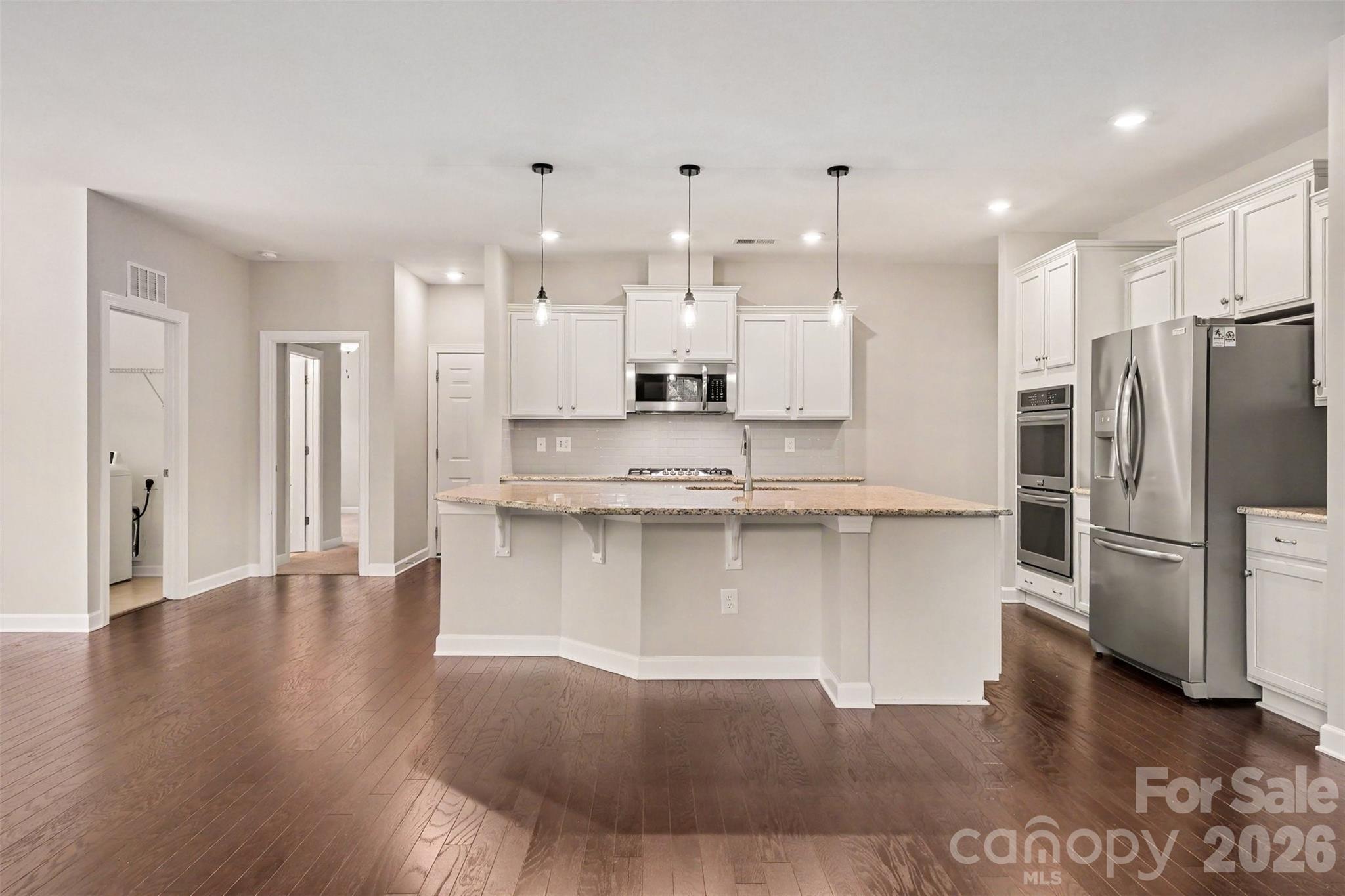 The kitchen features an expansive island - 2521 Surveyor General Drive, Waxhaw