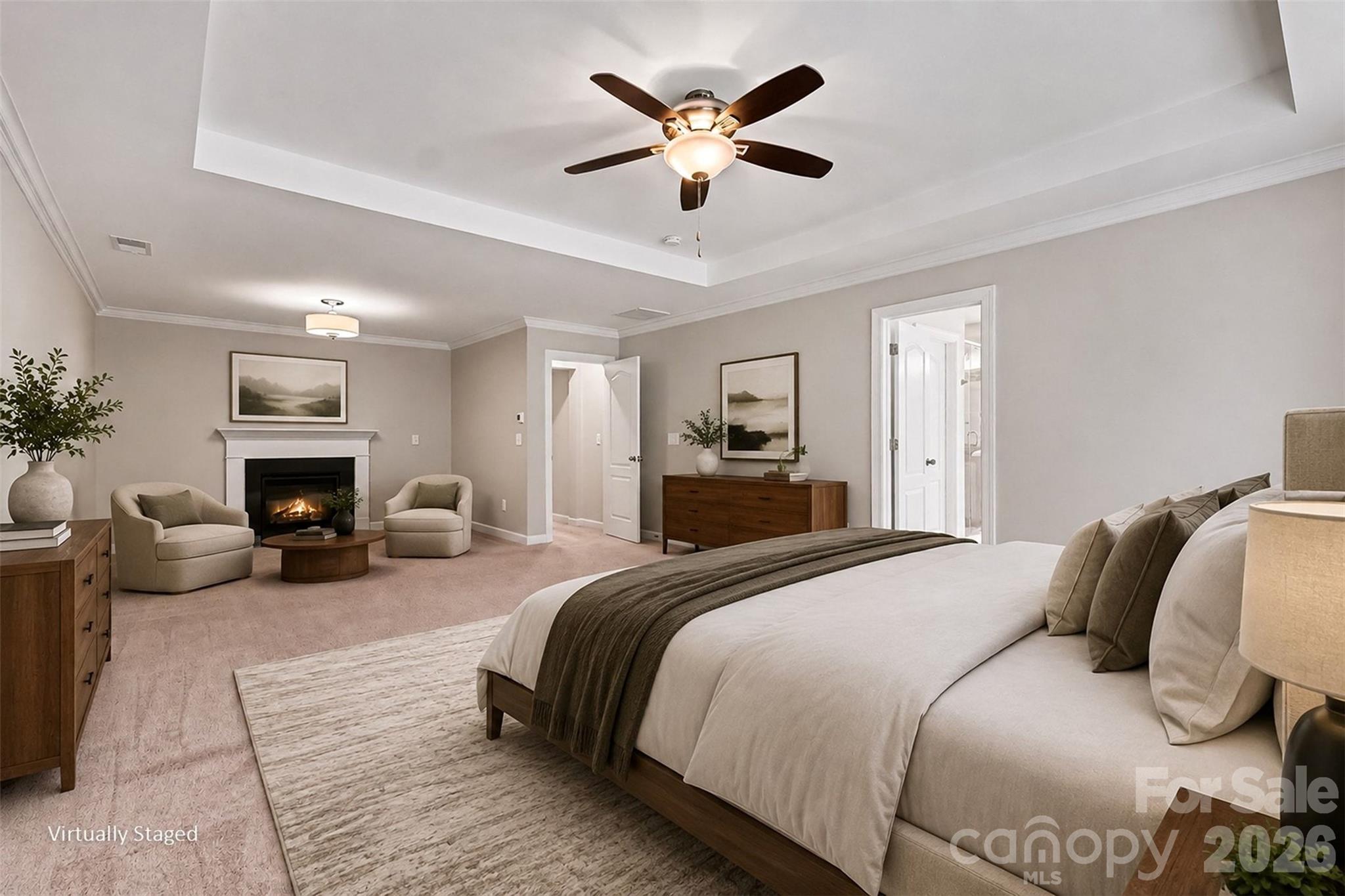 Primary bedroom with large sitting room anchored by a gas fireplace - 2521 Surveyor General Drive, Waxhaw