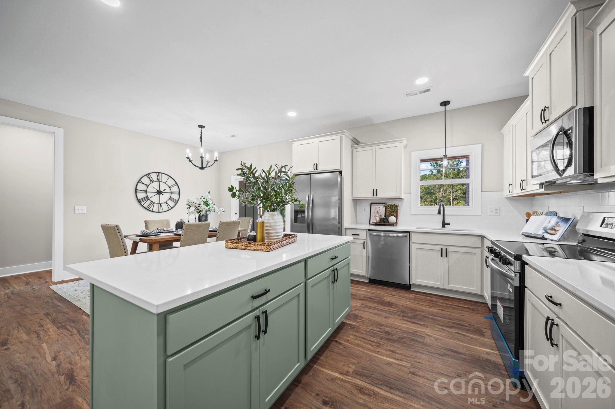 Kitchen open to dining - 224 Plantation Way, Mount Gilead