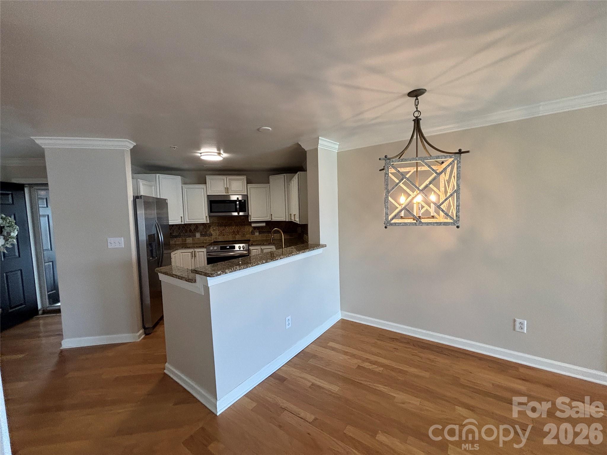 Dining area and kitchen counter. - 1332 Torrence Circle, Davidson