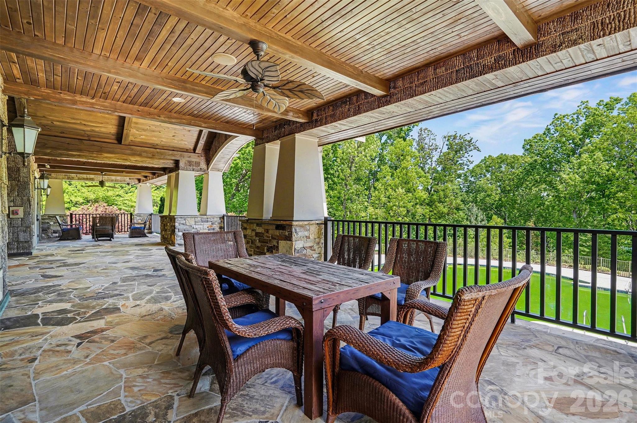 Meet up with friends on the clubhouse porch. It's shaded and breezy, with plenty of room to spread out. Having an event at the clubhouse? This is where the party spills out to enjoy the view. - 8027 Longwaters Court, York