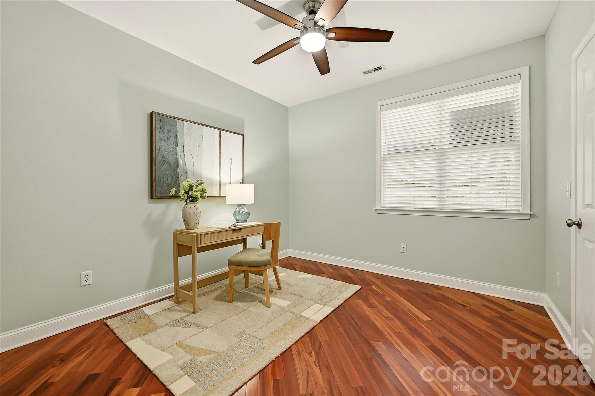 Third bedroom offers hardwood floors, a ceiling fan, and flexible space for a bedroom, office, or hobby room. - 9009 Rosalyn Glen Road, Cornelius