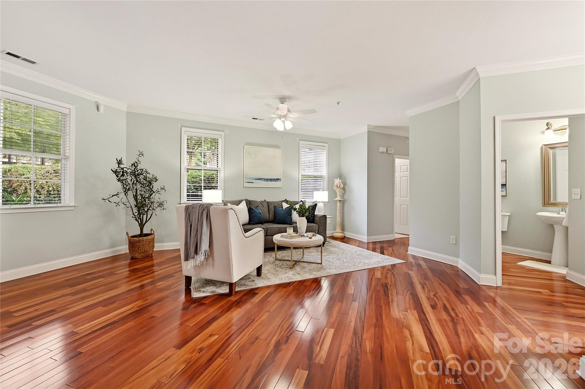 Open-concept living features hardwood floors and a flexible layout ideal for entertaining. - 9009 Rosalyn Glen Road, Cornelius