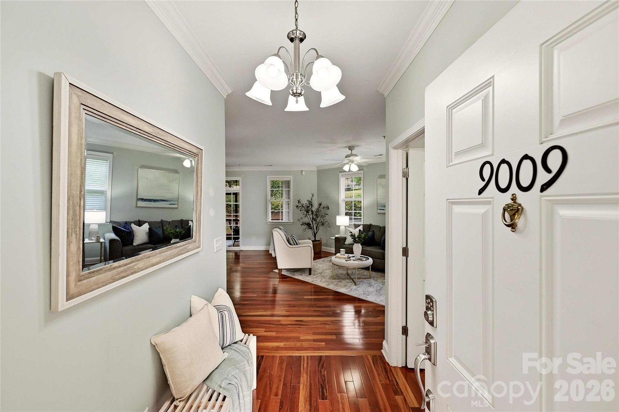 Welcoming foyer at 9009 Rosalyn Glen Road features beautiful hardwood floors and a bright, inviting entry into the home. - 9009 Rosalyn Glen Road, Cornelius