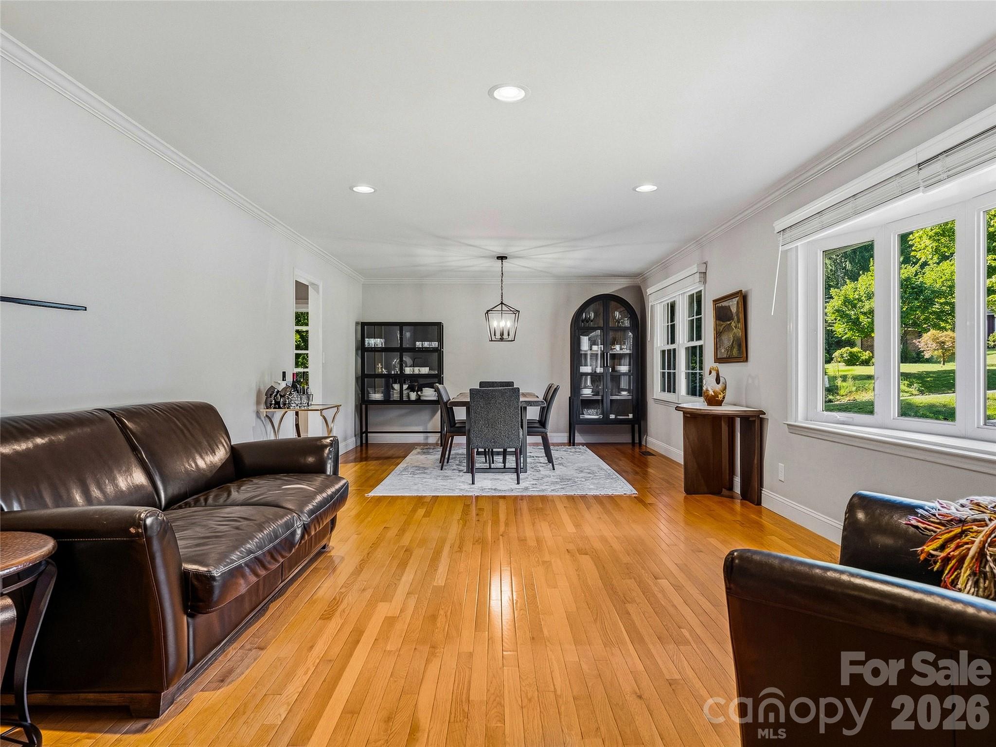 Open living room into dining room. - 531 Bluebird Ridge, Asheville