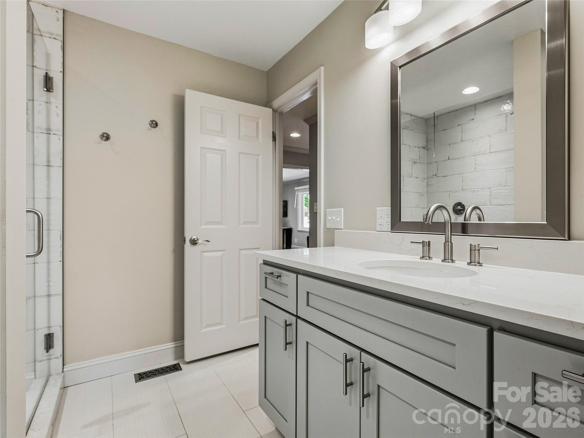 Upstairs bath between primary and hall. - 531 Bluebird Ridge, Asheville