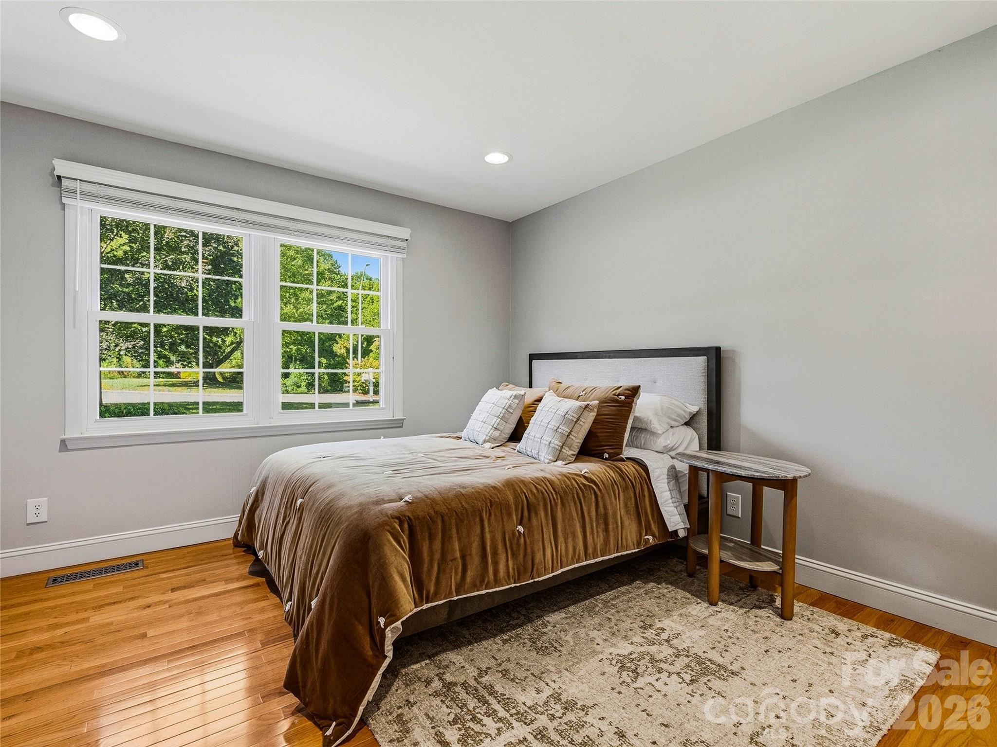 Second bedroom with built-in bookcase and laundry closet. - 531 Bluebird Ridge, Asheville