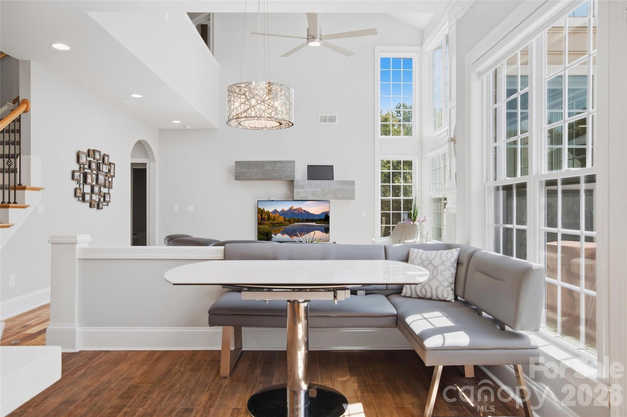 Motorized zebra blinds enhance the tall windows. - 5134 Cressingham Drive, Indian Land