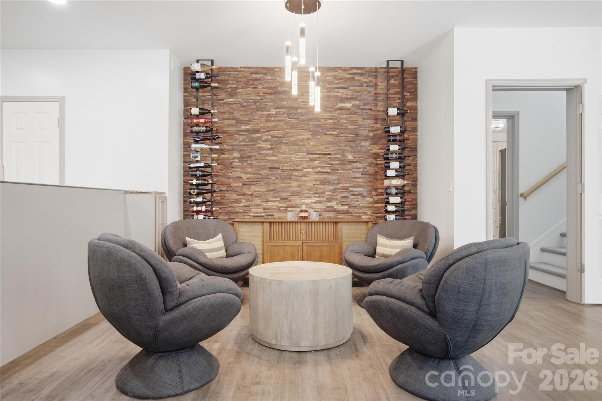 wine wall and seating area in basement - 5134 Cressingham Drive, Indian Land