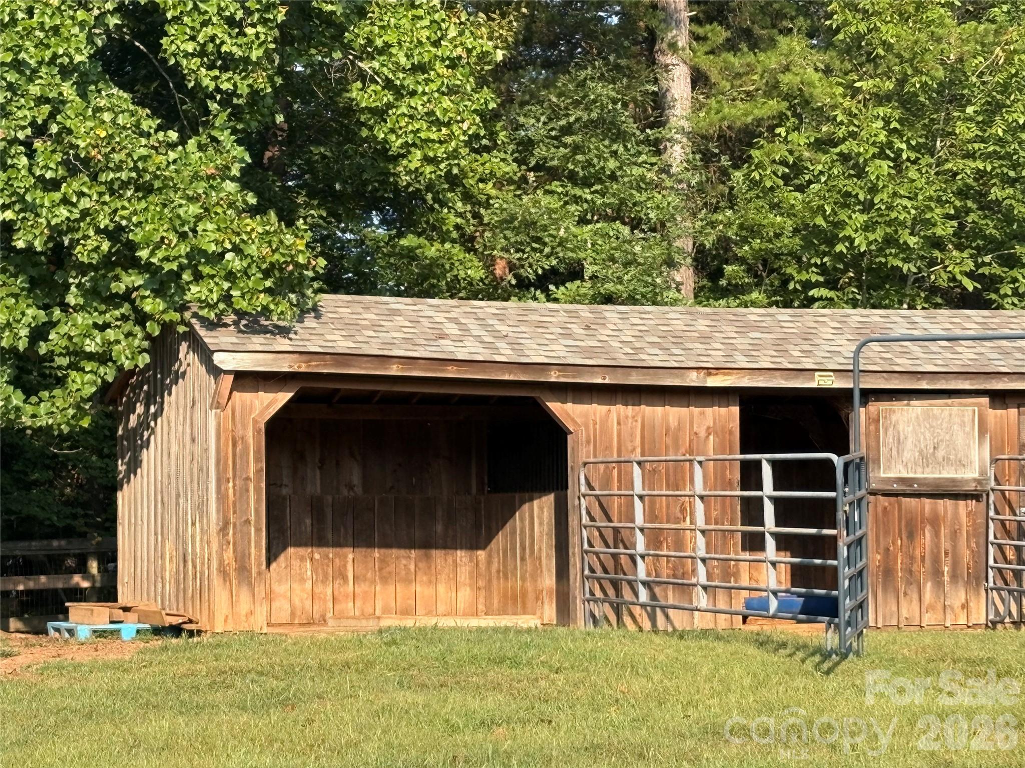 Great small barn with a run-in stall, a second stall, and a small storage room. - 27 & 56 Troy Lane, Tryon