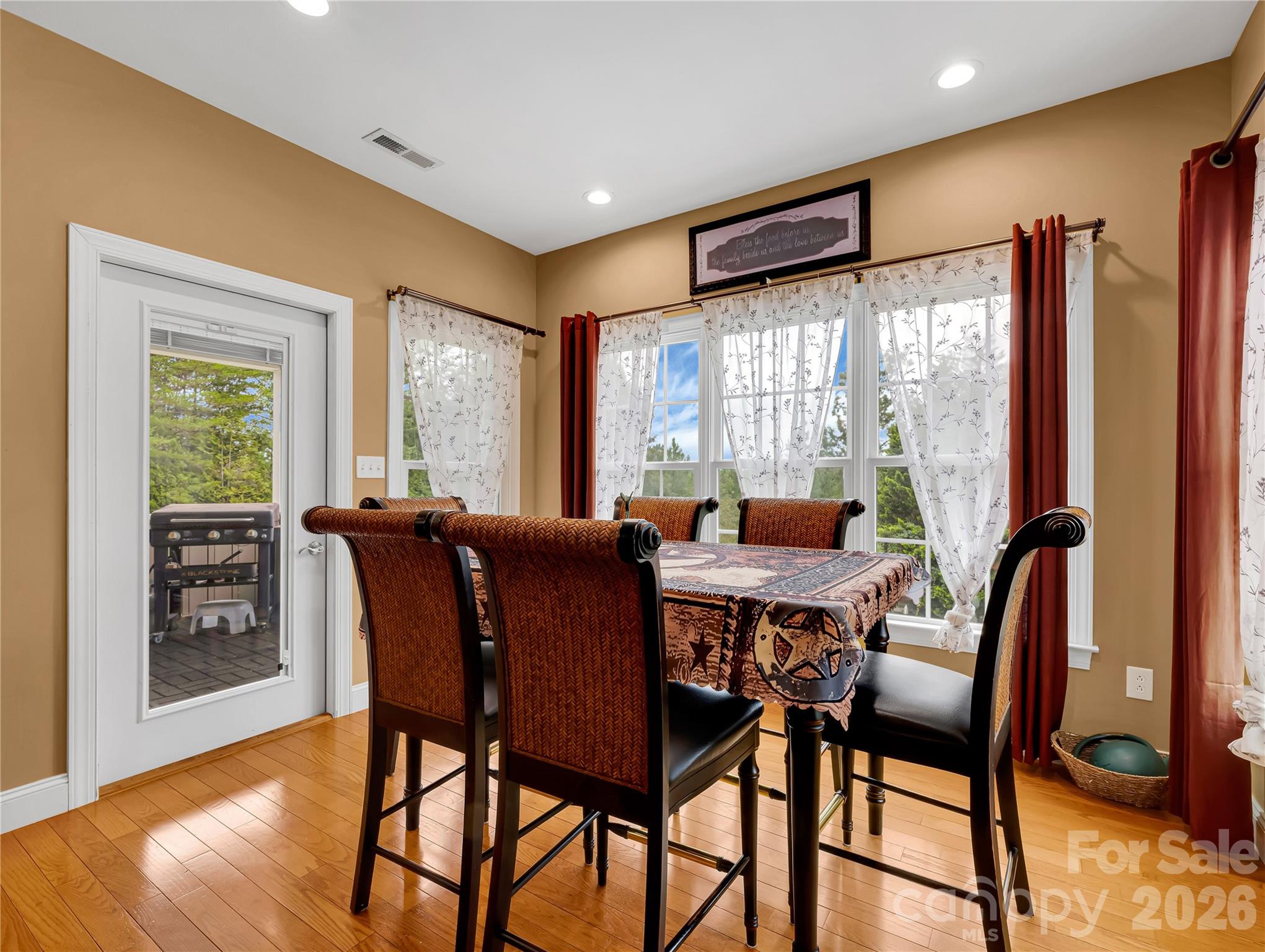 The breakfast room leads out to a covered porch with gas line for your outdoor grill, so very convenient! - 27 & 56 Troy Lane, Tryon
