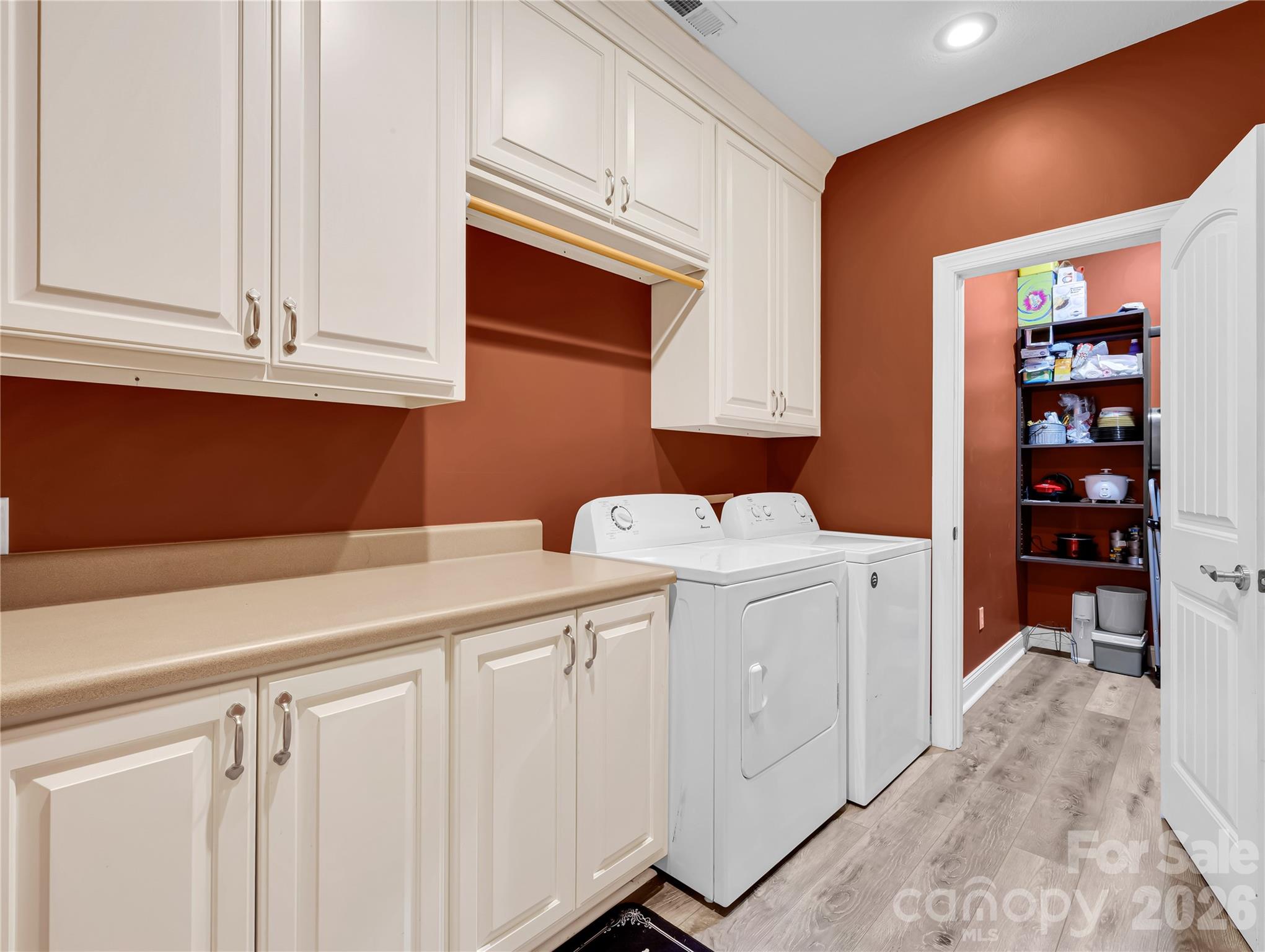 Laundry with extra storage and counter space and a utility closet / pantry at the rear - this is a well thought out floor plan with so much storage - you will never be short on space. - 27 & 56 Troy Lane, Tryon