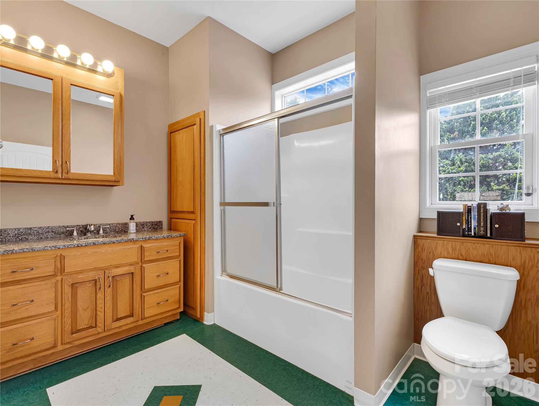 Full bath on the lower level with a tub/shower combination right next to the entrance to the pool and patio. So convenient! - 27 & 56 Troy Lane, Tryon