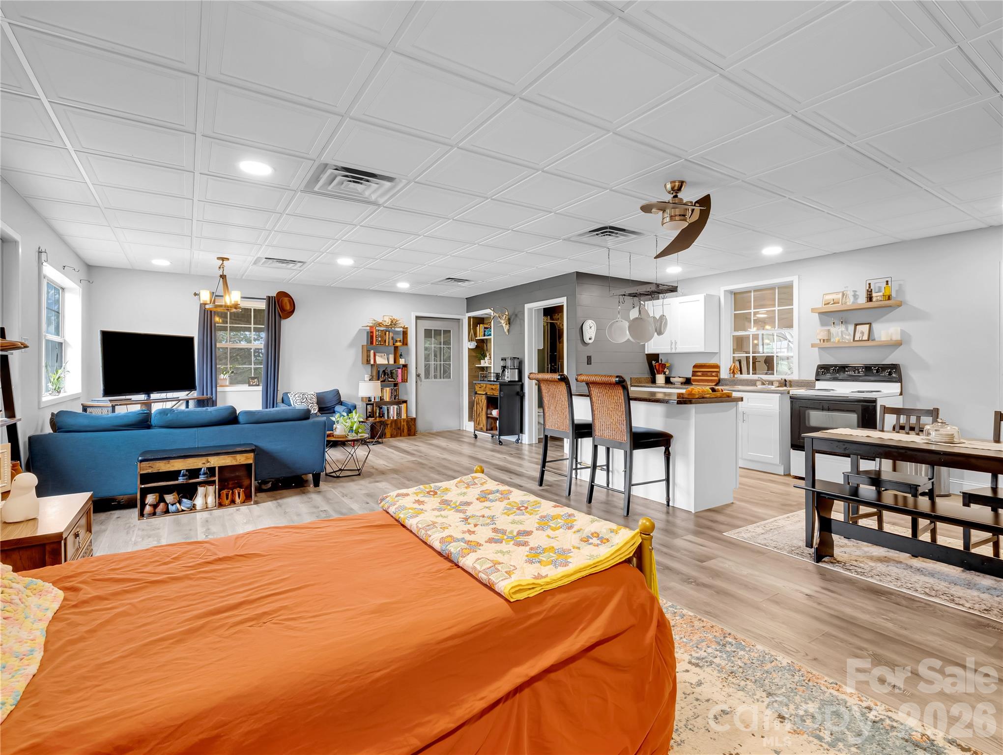This corner of the living space is currently being used as a second bedroom area. - 27 & 56 Troy Lane, Tryon
