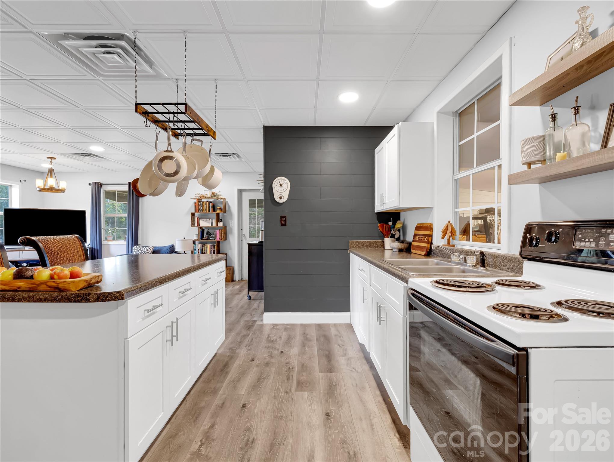 This compact kitchen is designed well and this home is currently a full time residence for three people. - 27 & 56 Troy Lane, Tryon
