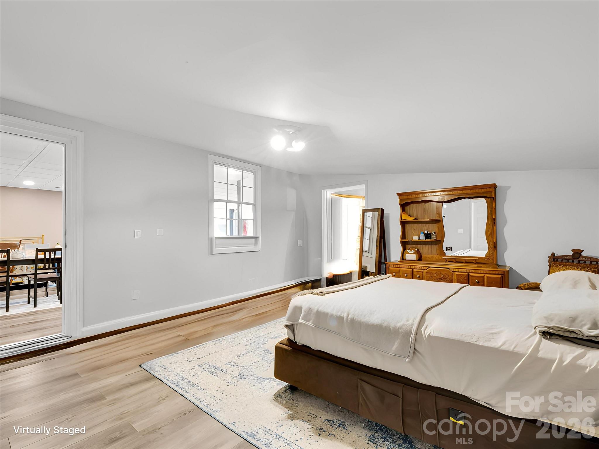 Spacious bedroom in guest house has a huge walk in closet that could also serve as an office or second sleeping area. - 27 & 56 Troy Lane, Tryon