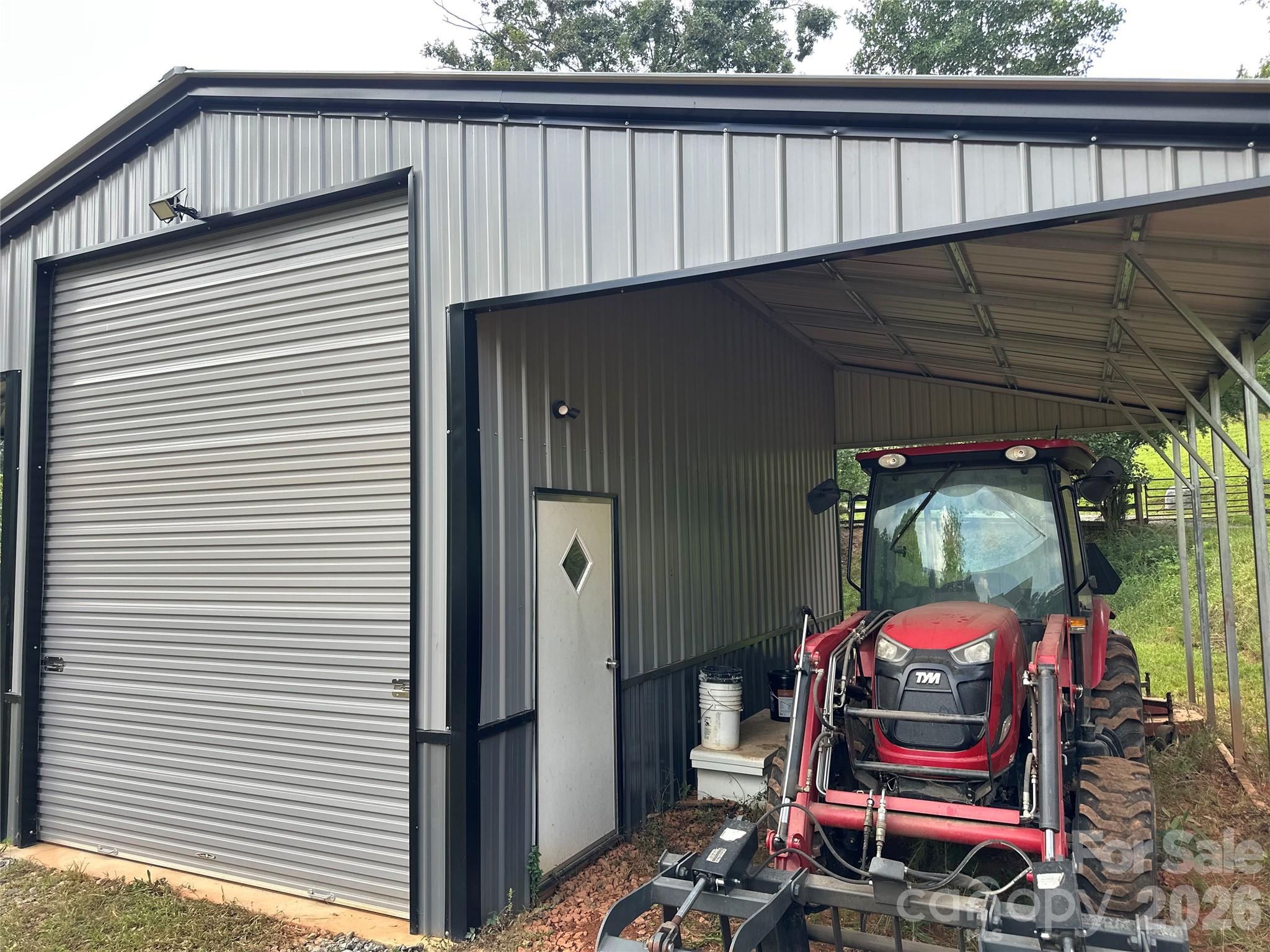 10' high overhang is 12' wide. This is a very useful building and a great addition to the property! - 27 & 56 Troy Lane, Tryon