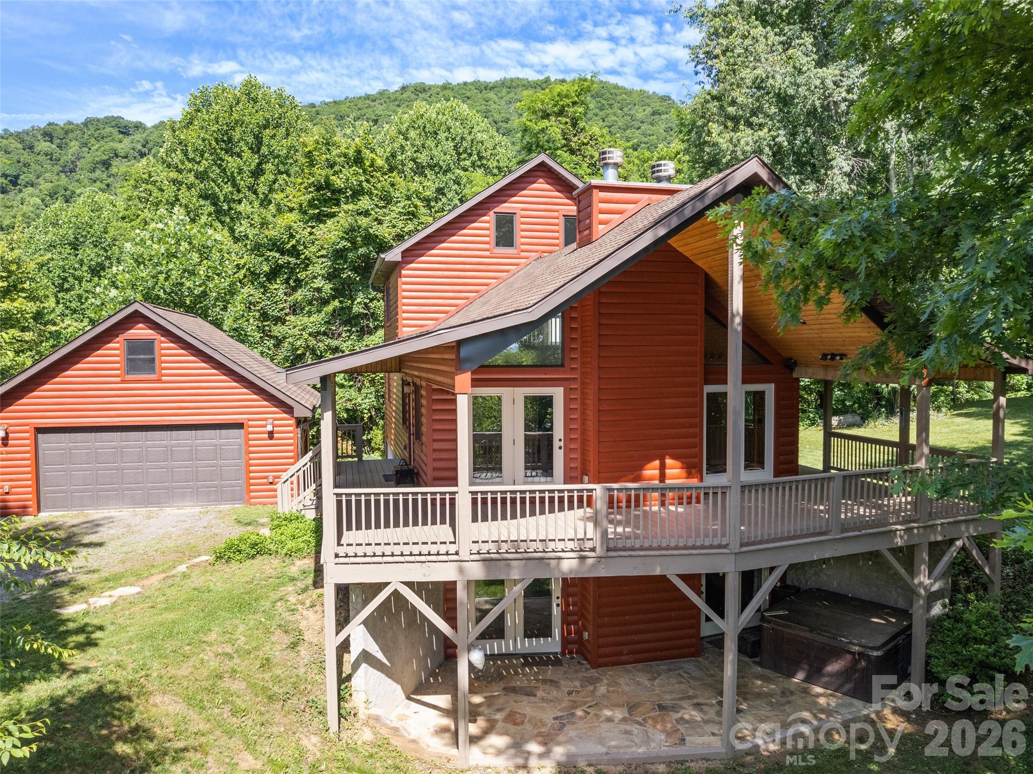 Expansive covered porch and patio brings the outside indoors - 51 Stony Pond Lane, Canton