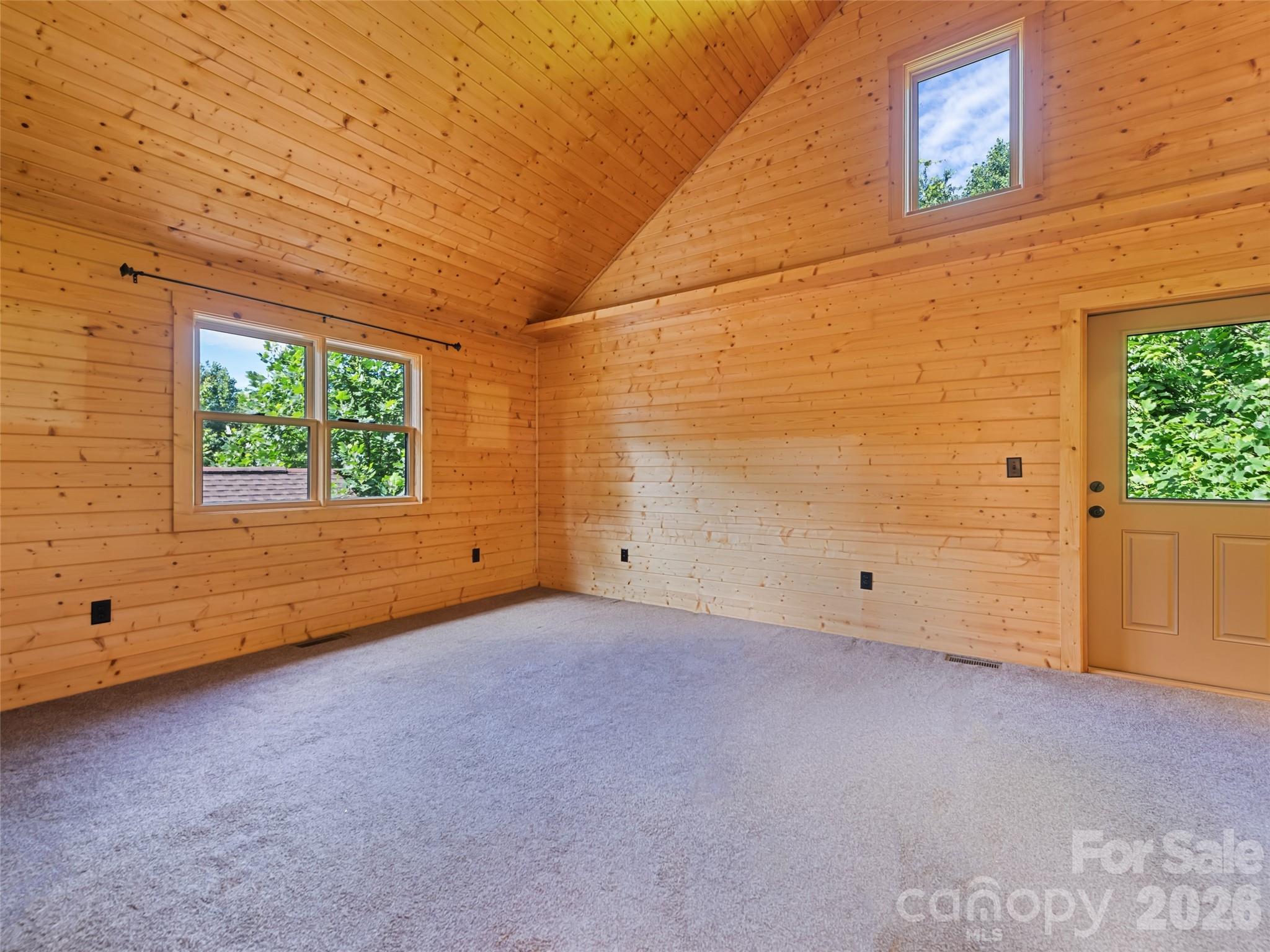 Beautiful tongue and groove cathedral ceiling and walls in the primary suite - 51 Stony Pond Lane, Canton
