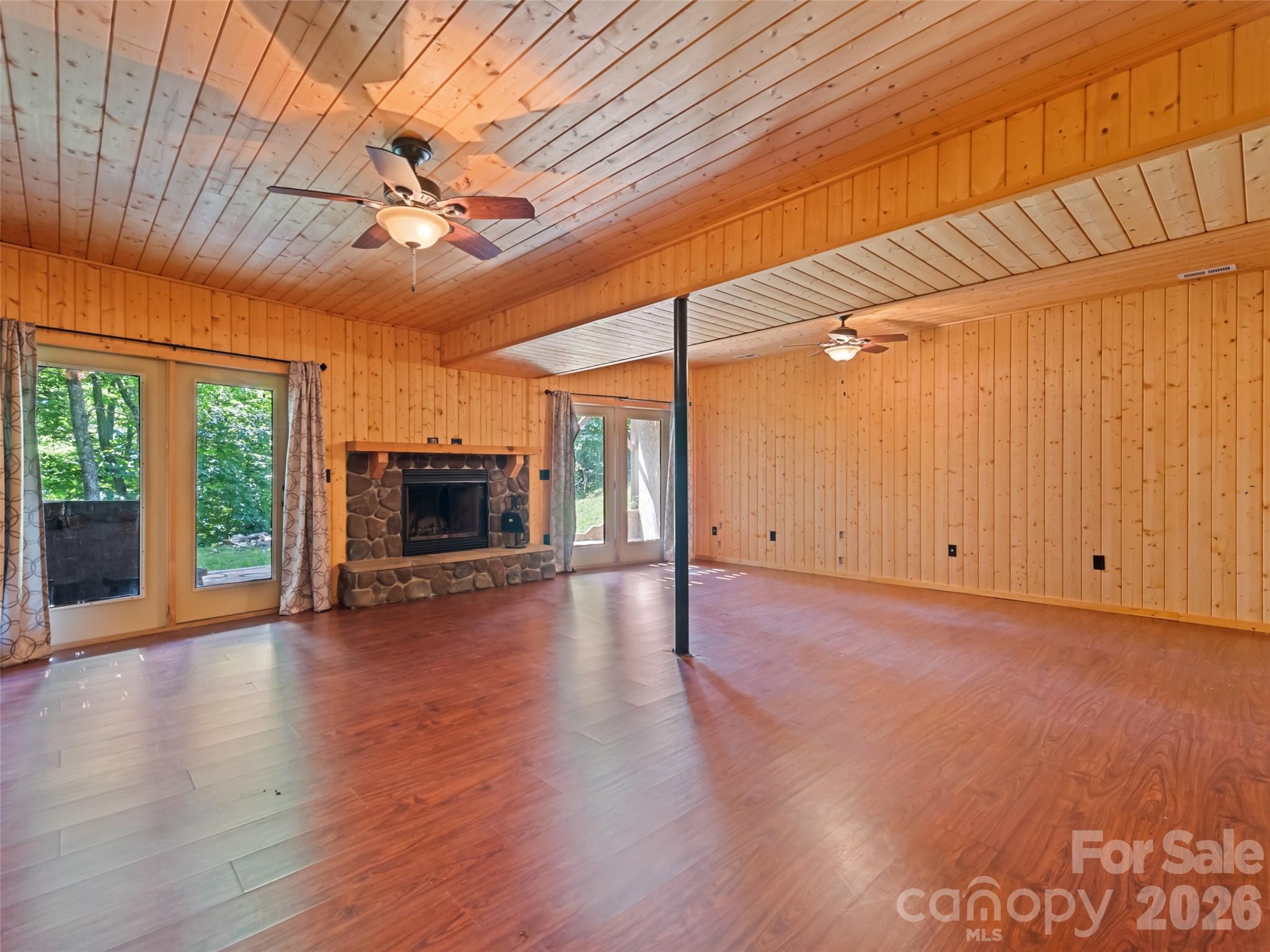 Downstairs den with wood burning fireplace insert - 51 Stony Pond Lane, Canton