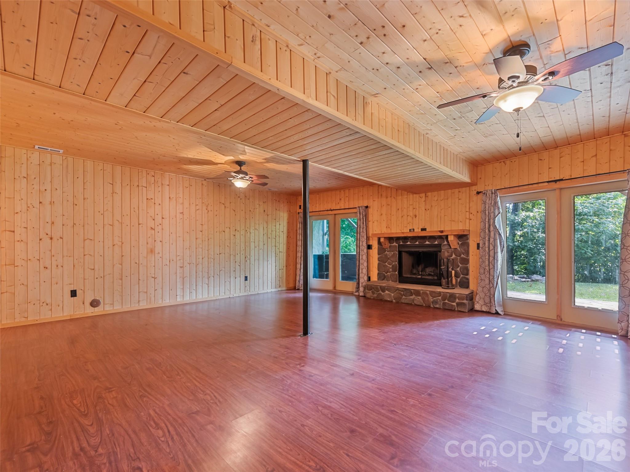 Downstairs den leads to lower patio with included hot tub - 51 Stony Pond Lane, Canton
