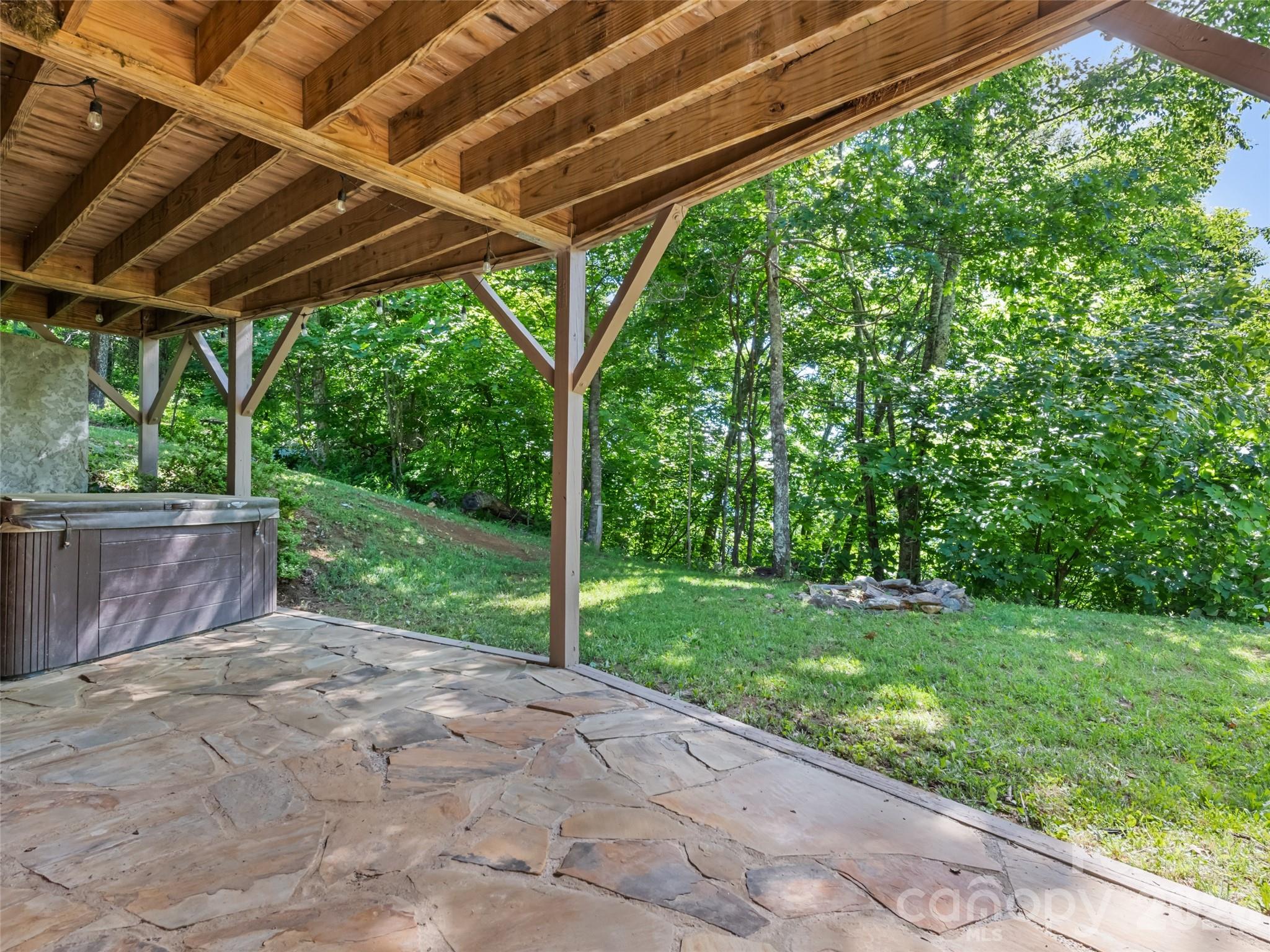 Covered natural stone patio with included hot tub - 51 Stony Pond Lane, Canton