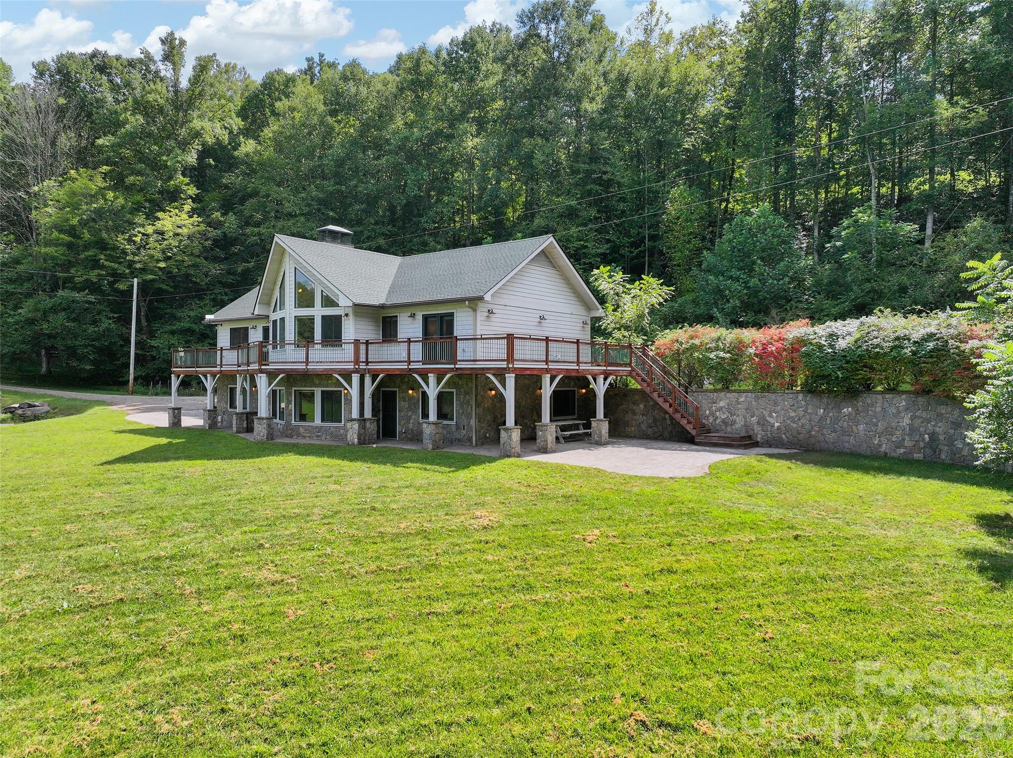 Beautifully crafted home surrounded by open lawn and wooded privacy. - 174b Marina Cove, Waynesville