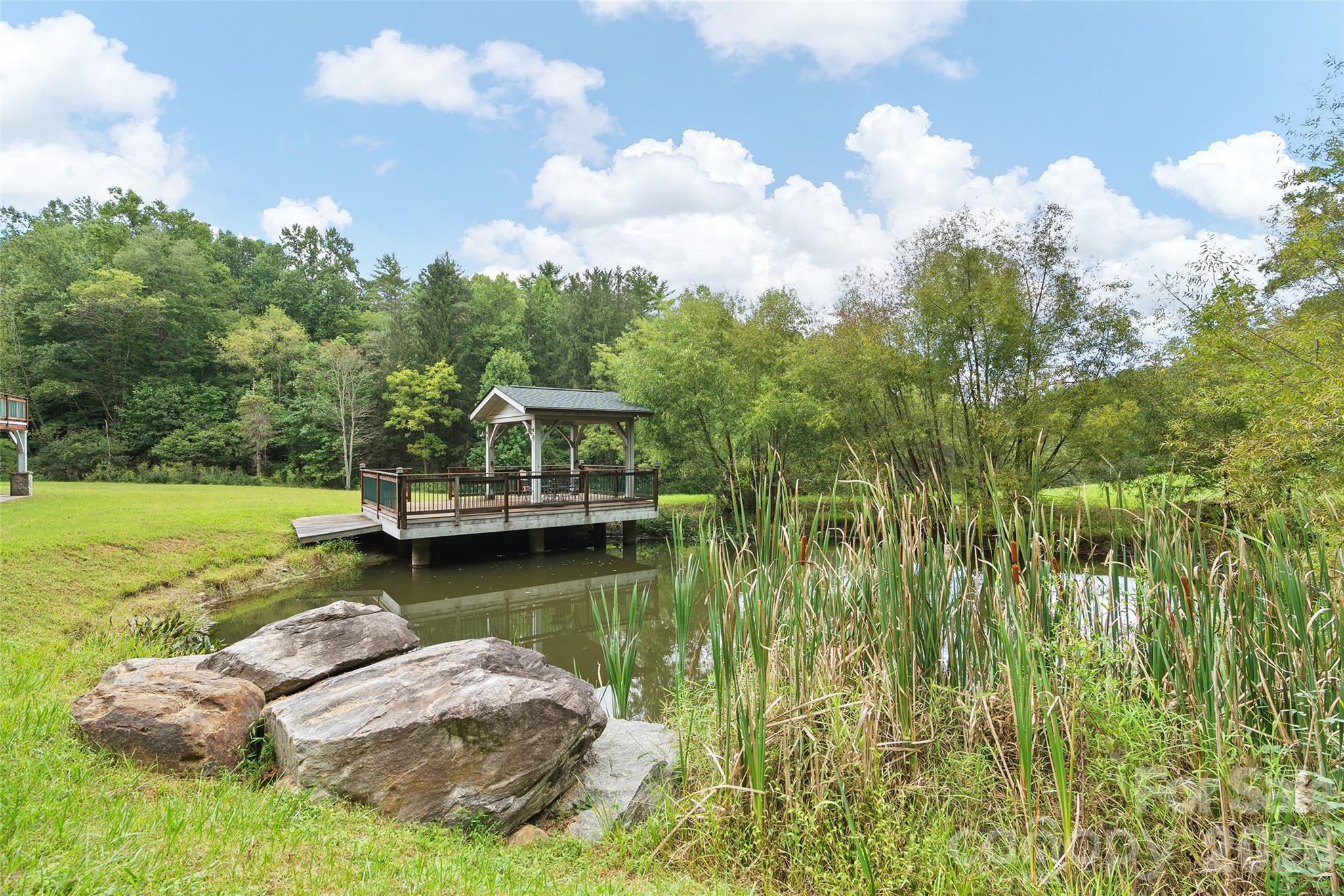 A peaceful pond creates a beautiful centerpiece for this private mountain estate. - 174b Marina Cove, Waynesville