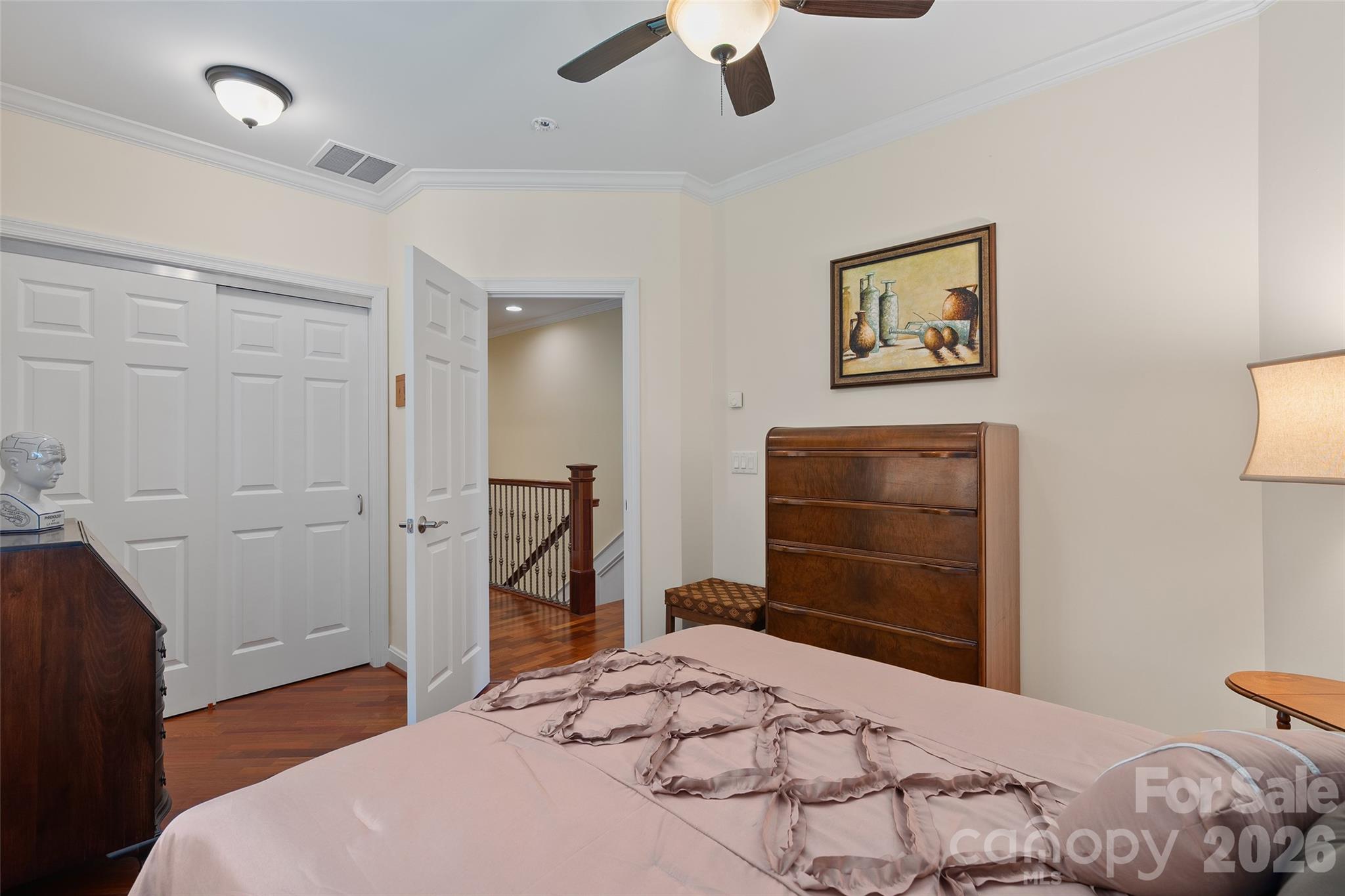 Comfortable secondary bedroom with hardwood flooring and abundant natural light. - 174b Marina Cove, Waynesville