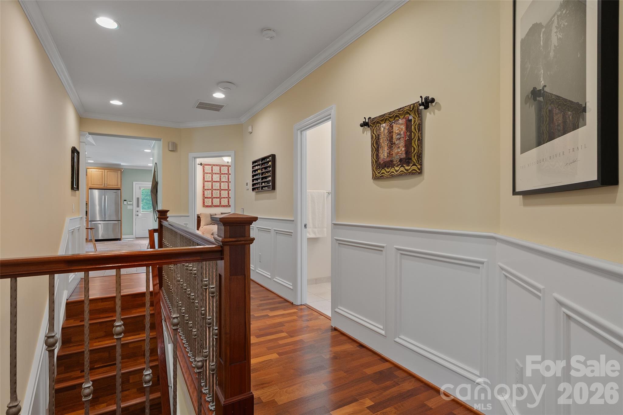 Beautiful interior millwork and hardwood flooring continue throughout the main level. - 174b Marina Cove, Waynesville