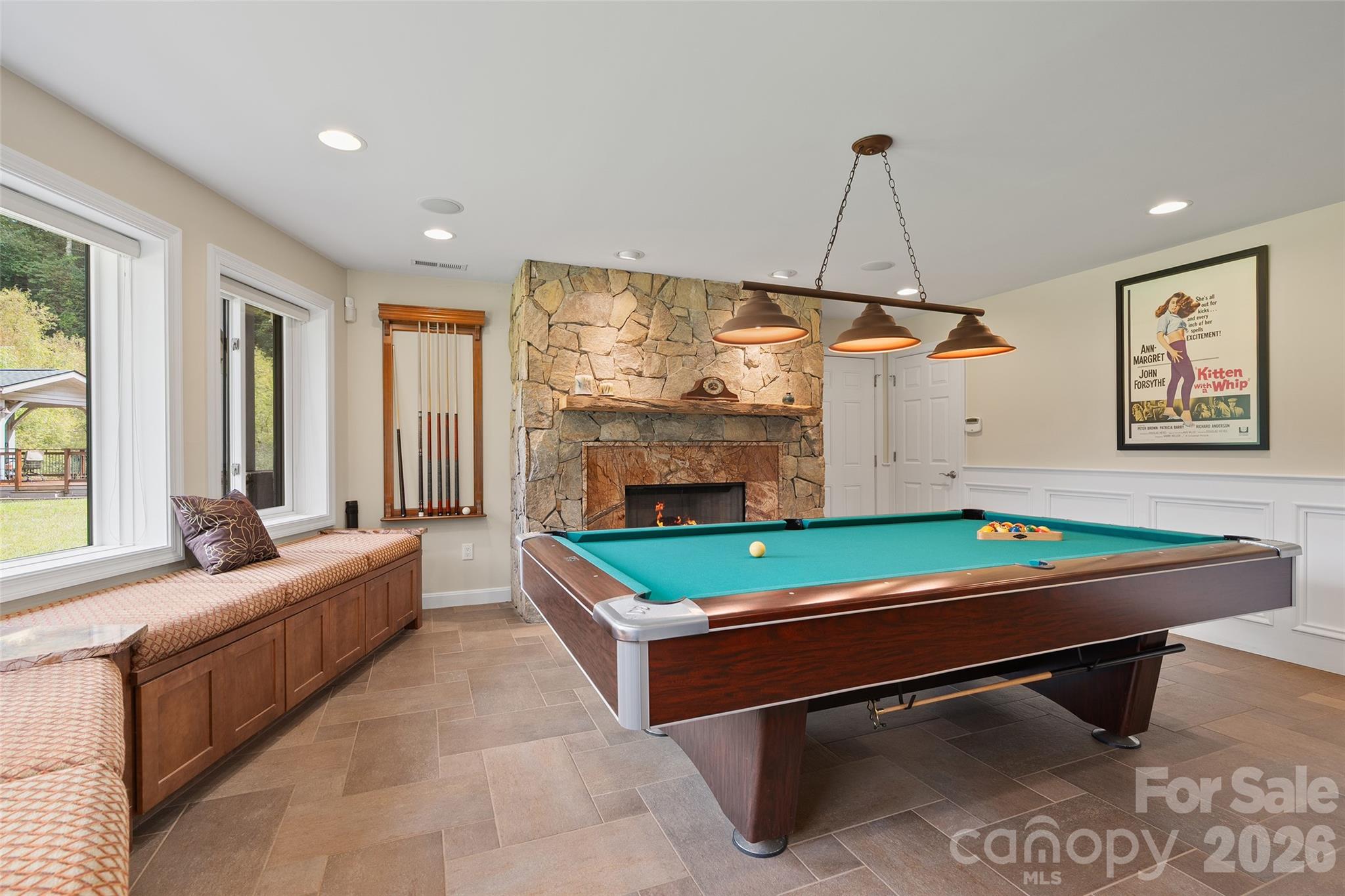 Spacious recreation room with stone fireplace—perfect for entertaining, games and relaxed gatherings. - 174b Marina Cove, Waynesville