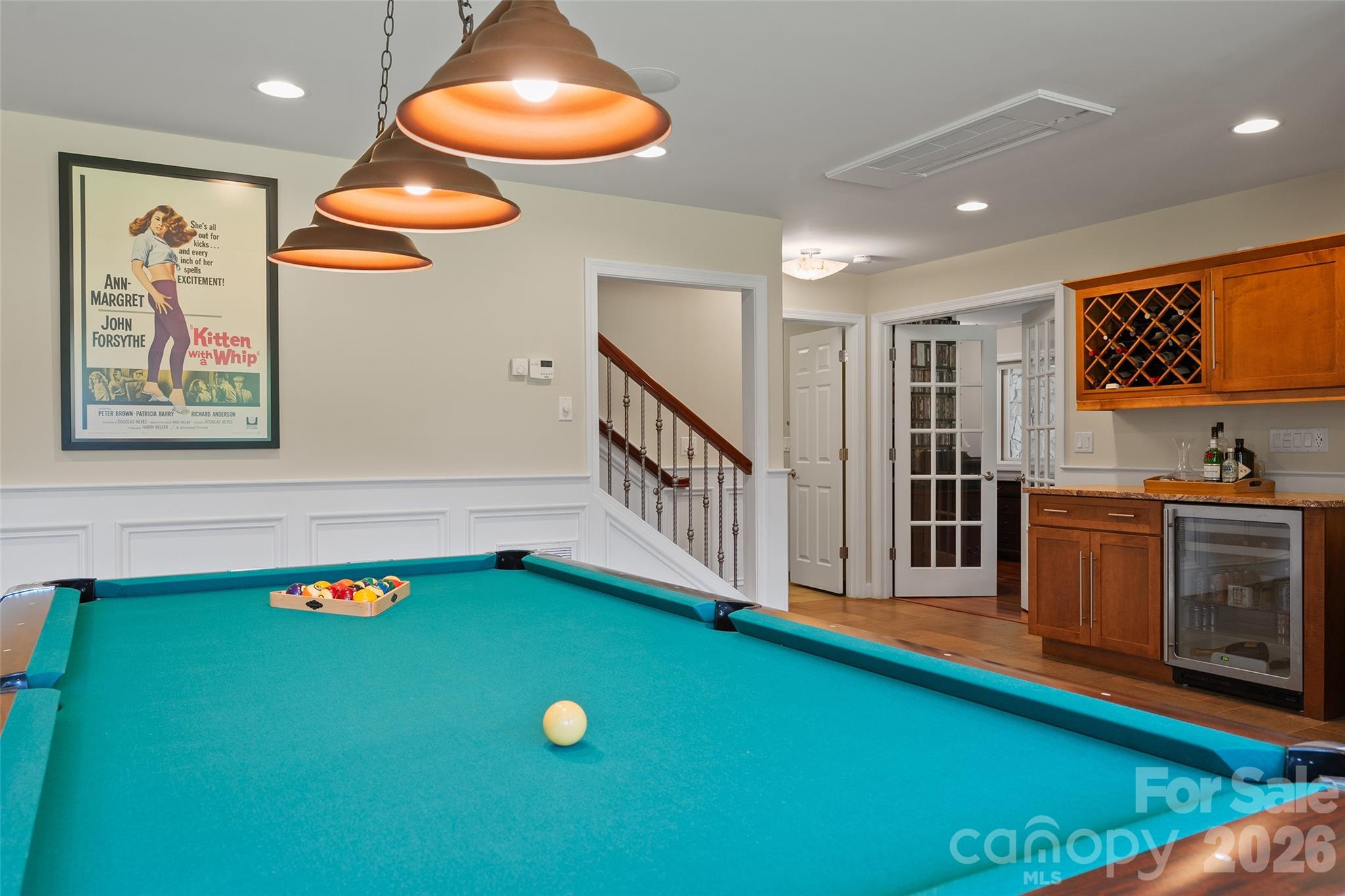 Custom bar makes the lower-level recreation area ready for entertaining. - 174b Marina Cove, Waynesville