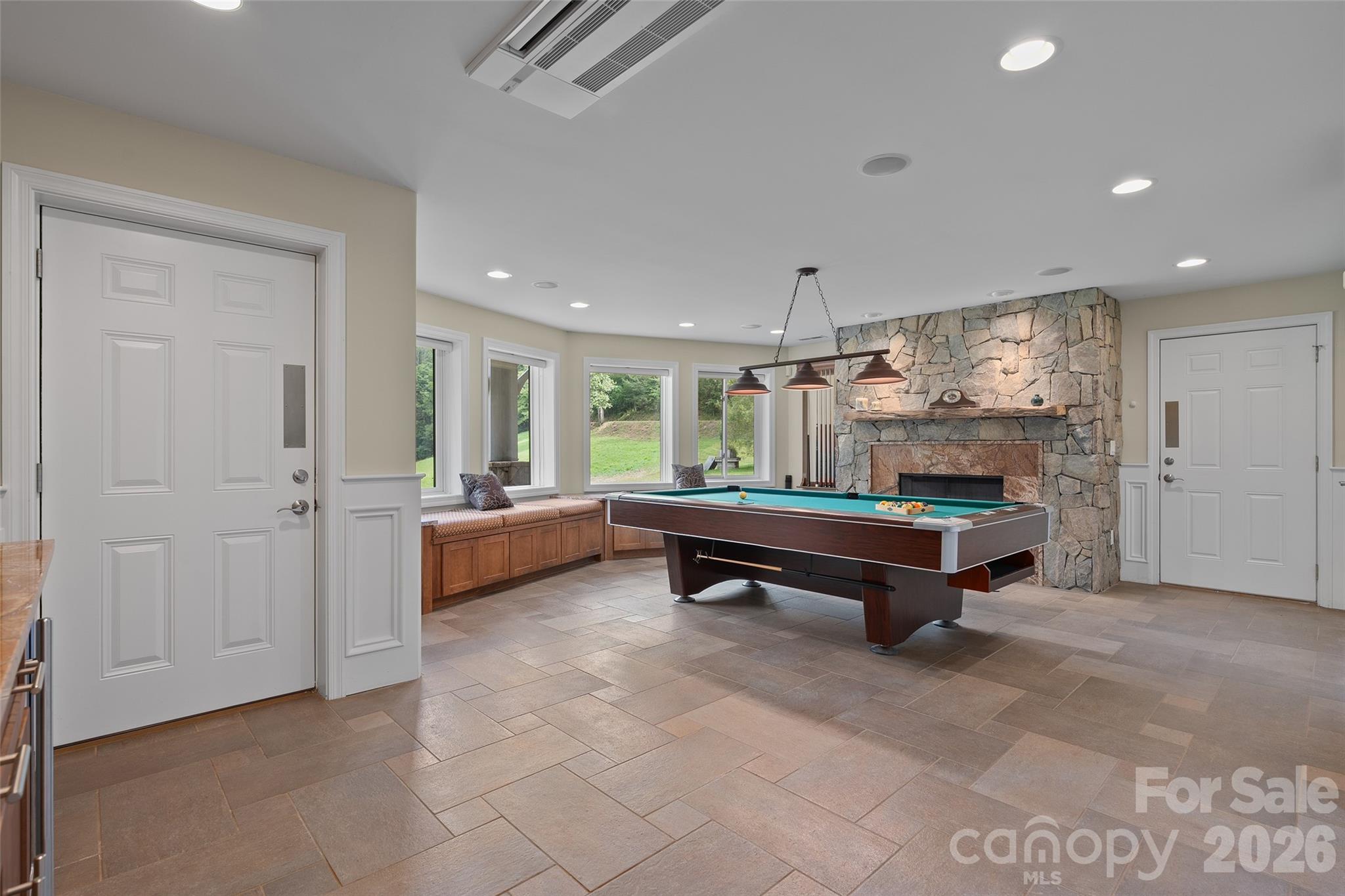 An impressive lower-level gathering space with room for billiards, entertaining and more. - 174b Marina Cove, Waynesville