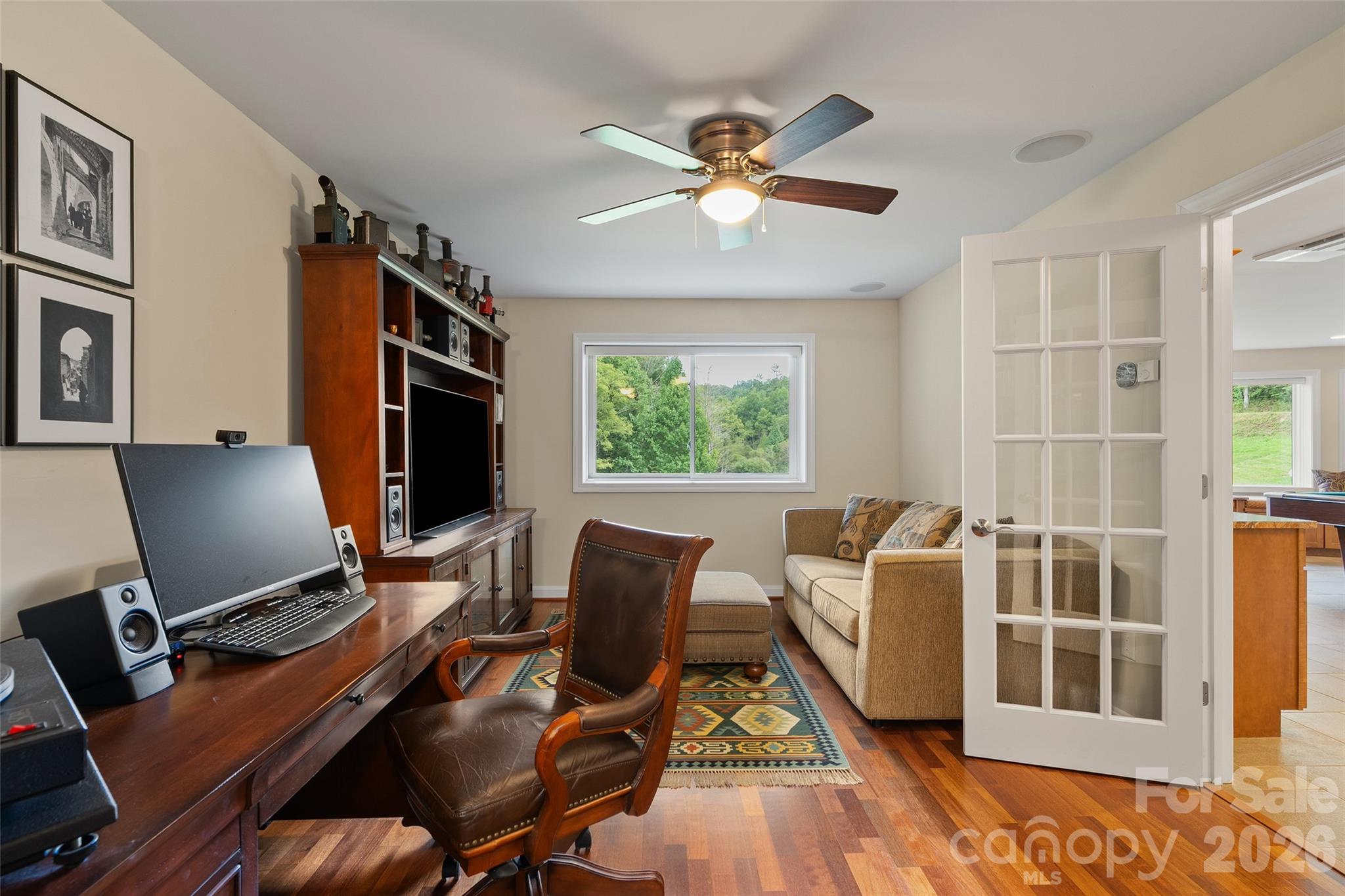 Additional flexible living space offers numerous possibilities for office, media or hobby use. - 174b Marina Cove, Waynesville