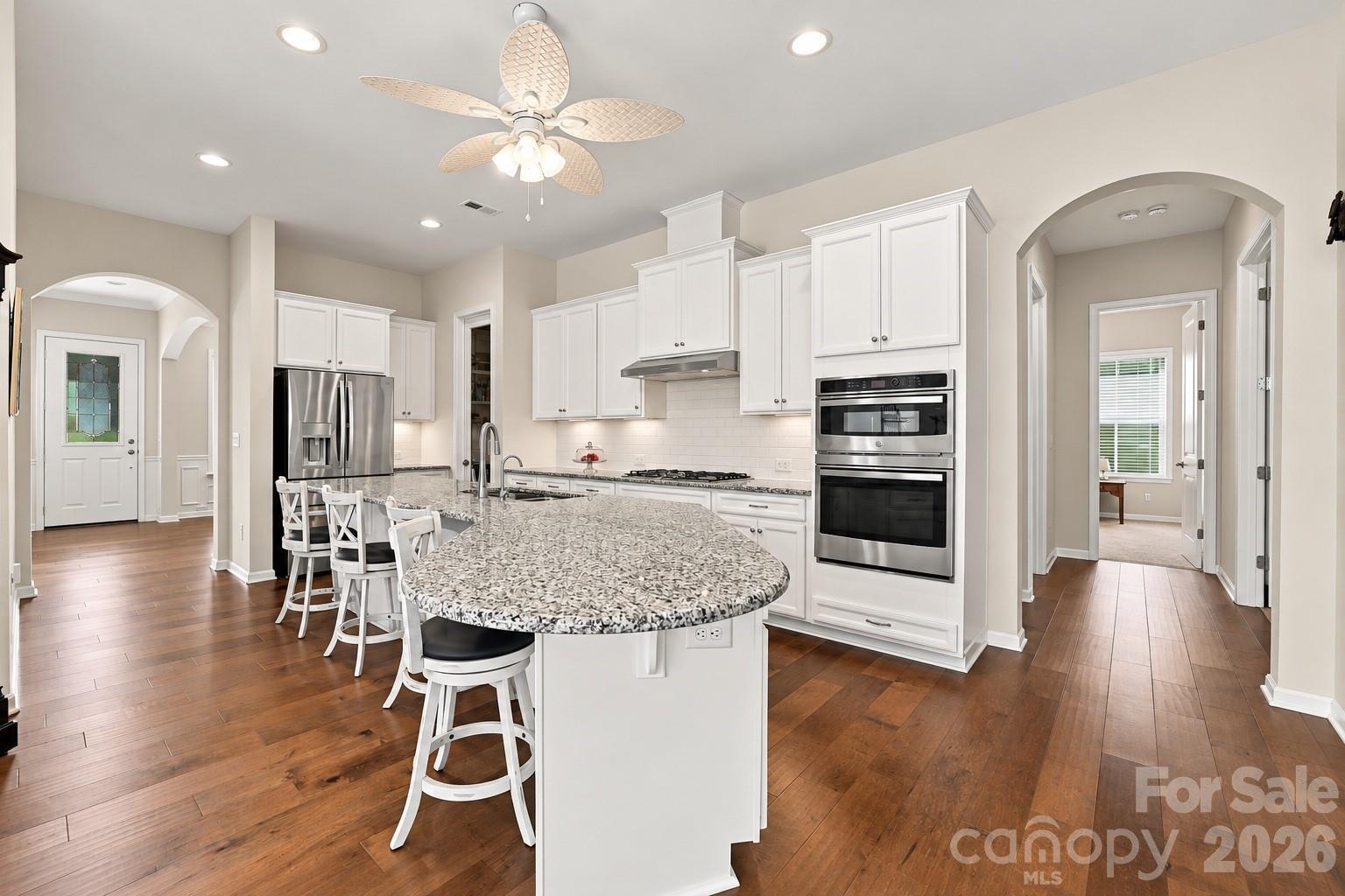 The heart of the home: expansive kitchen with granite counters, huge island, plenty of prep space, room for everyone to join in. - 8504 Hope Run Court, Indian Land