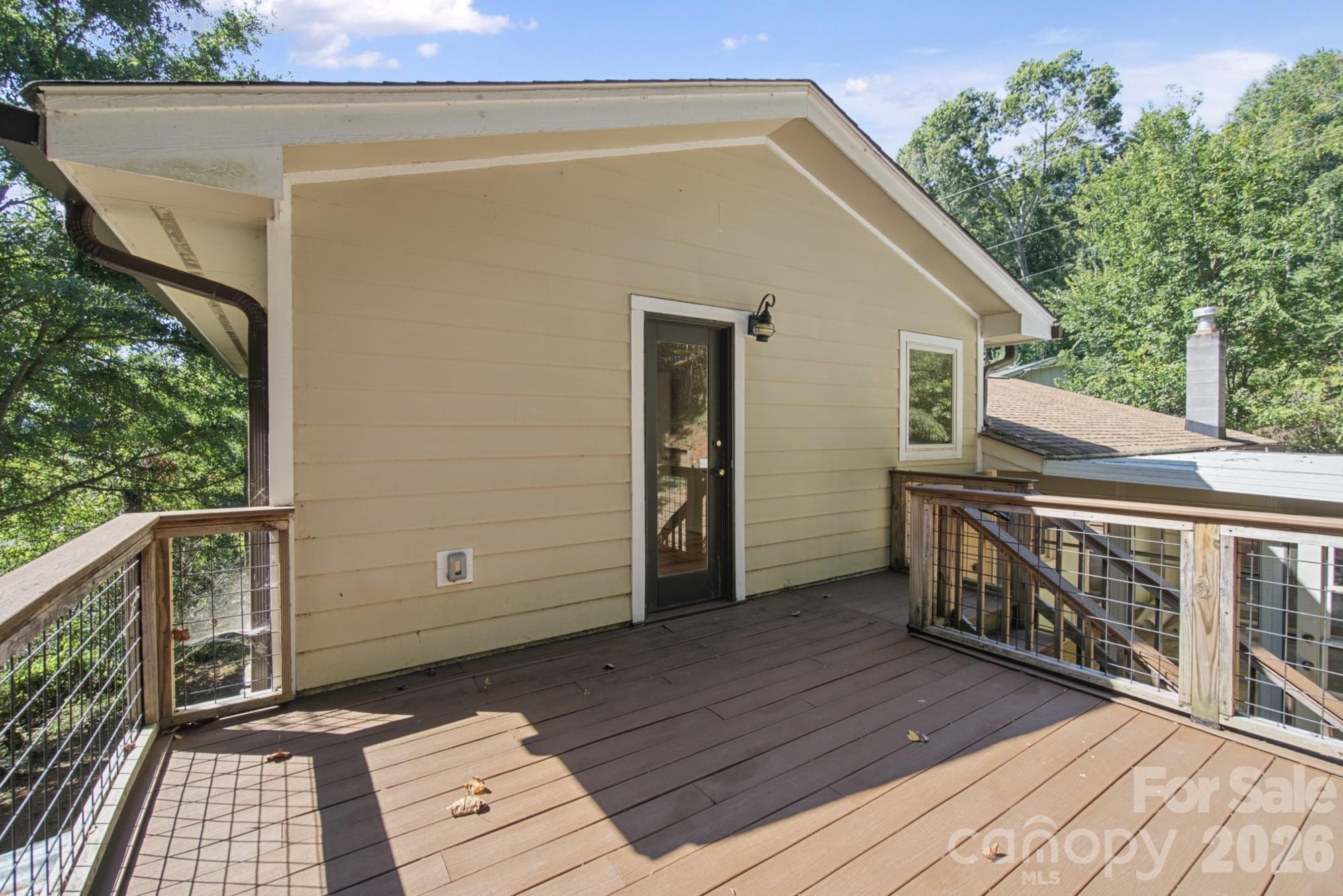 Large, raised back deck off of the Primary Bedroom - 35 Clement Drive, Asheville