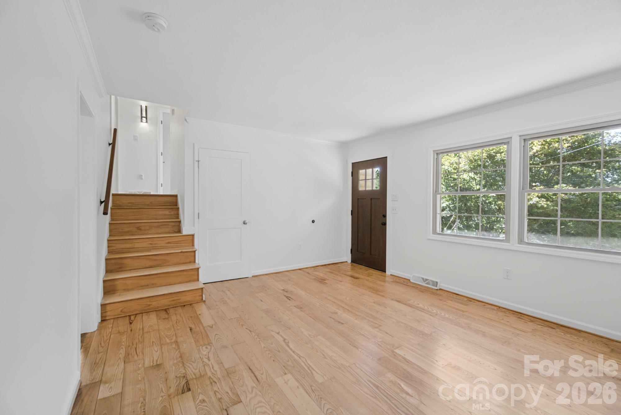 Stairs leading up to 3 of the bedrooms and 2 of the baths - 35 Clement Drive, Asheville