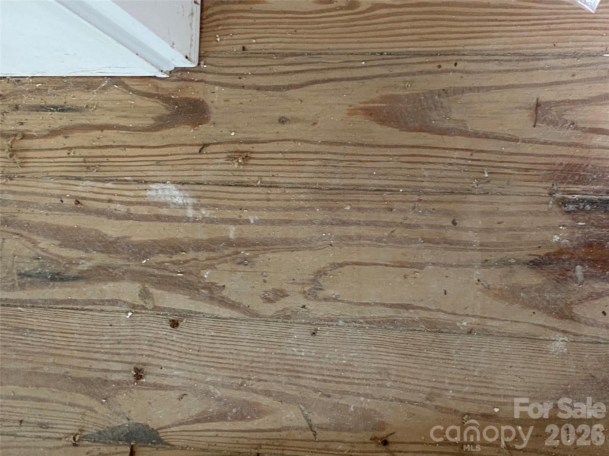 Beautiful real wood floors preserved and ready to be refinished in the front of the house - 615 Vine Arden Road, Morganton