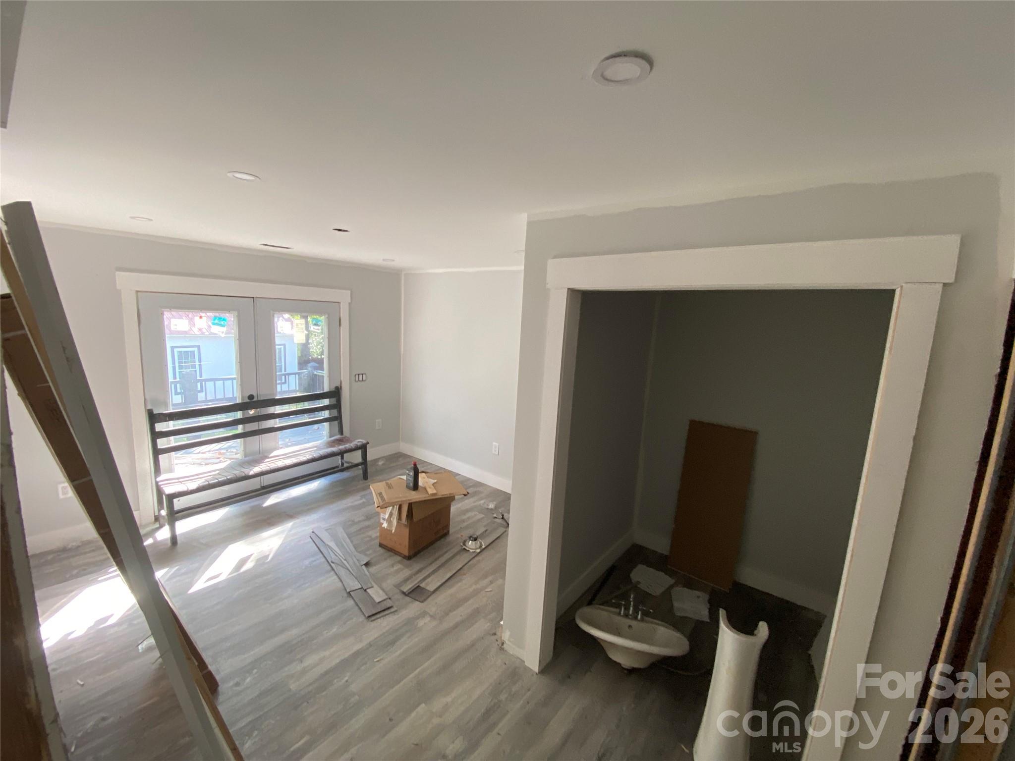 Primary Suite w/ Walk-in Closet and Pocket Door Bath w/ Electric Modern Toilet and Pedastal Sink - 615 Vine Arden Road, Morganton