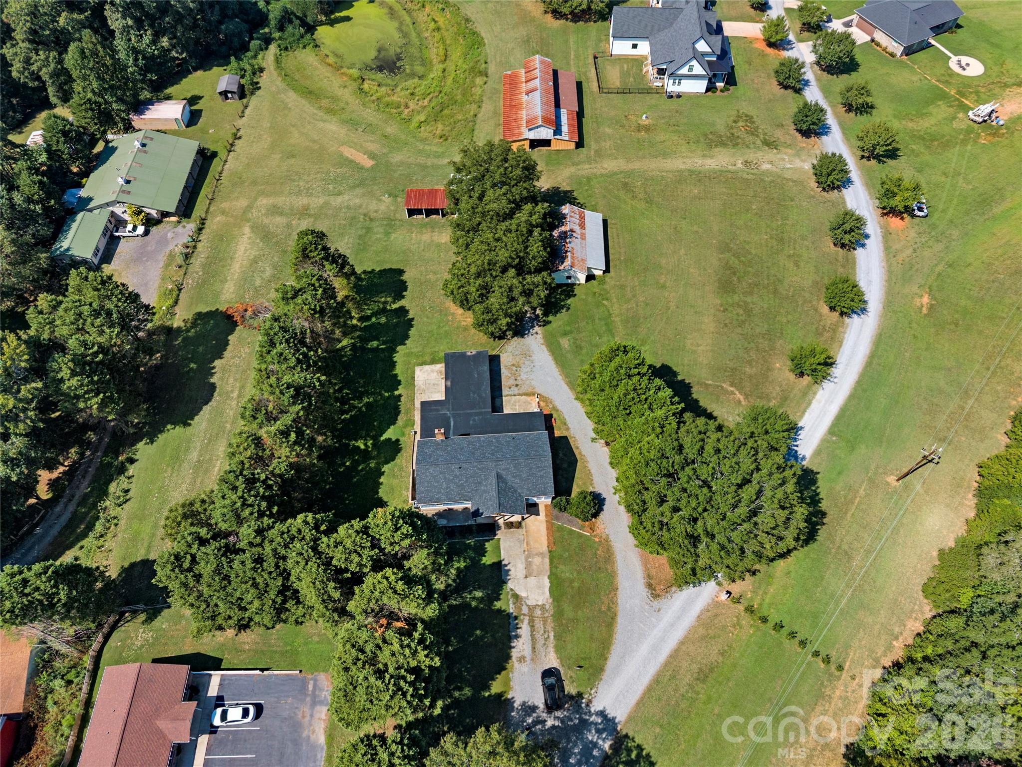 .86 acre lot surrounded by mature trees and offering private driveways to each entry point - 109 Woodside Avenue, Gastonia