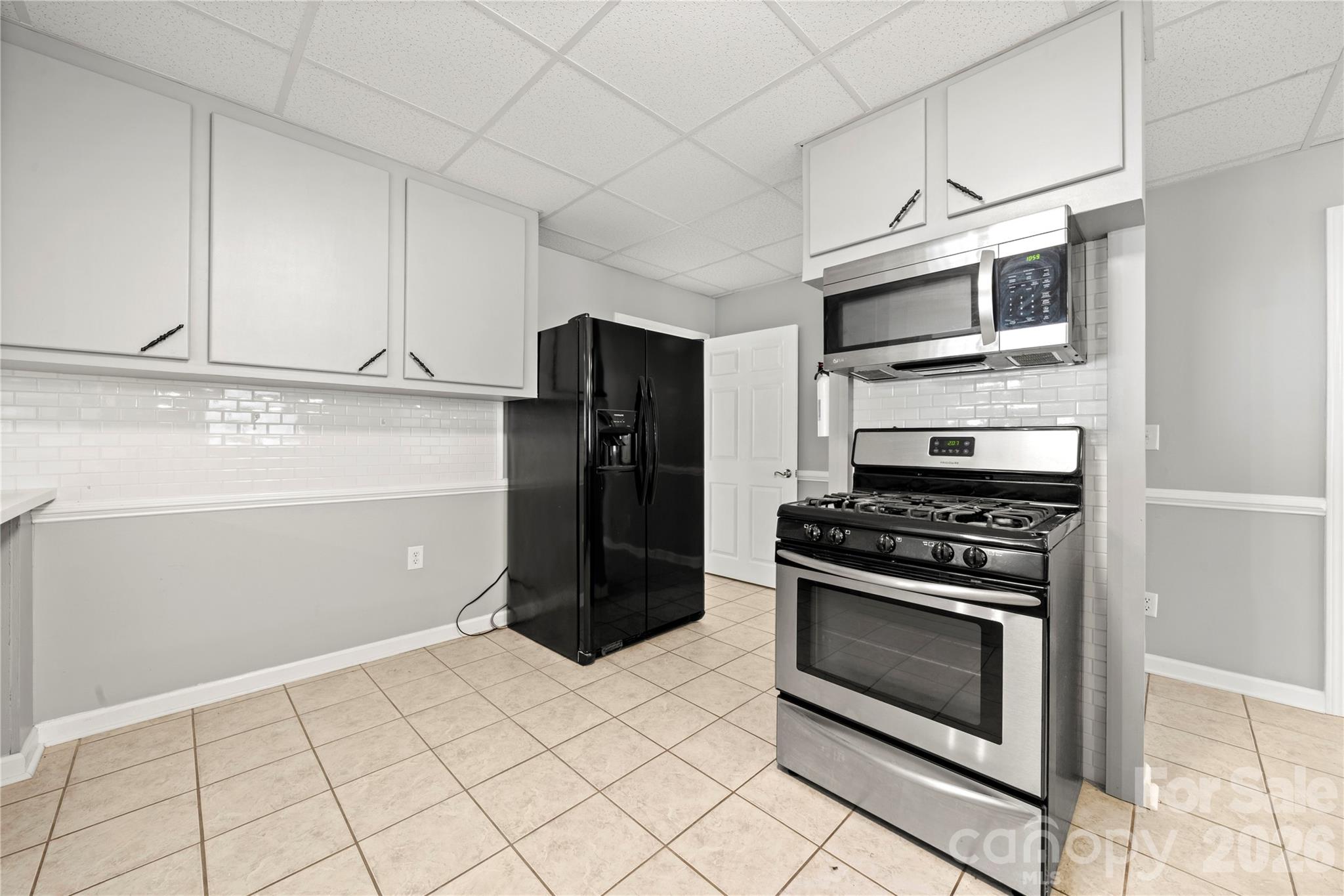 Basement level full kitchen - fridge to convey - 109 Woodside Avenue, Gastonia