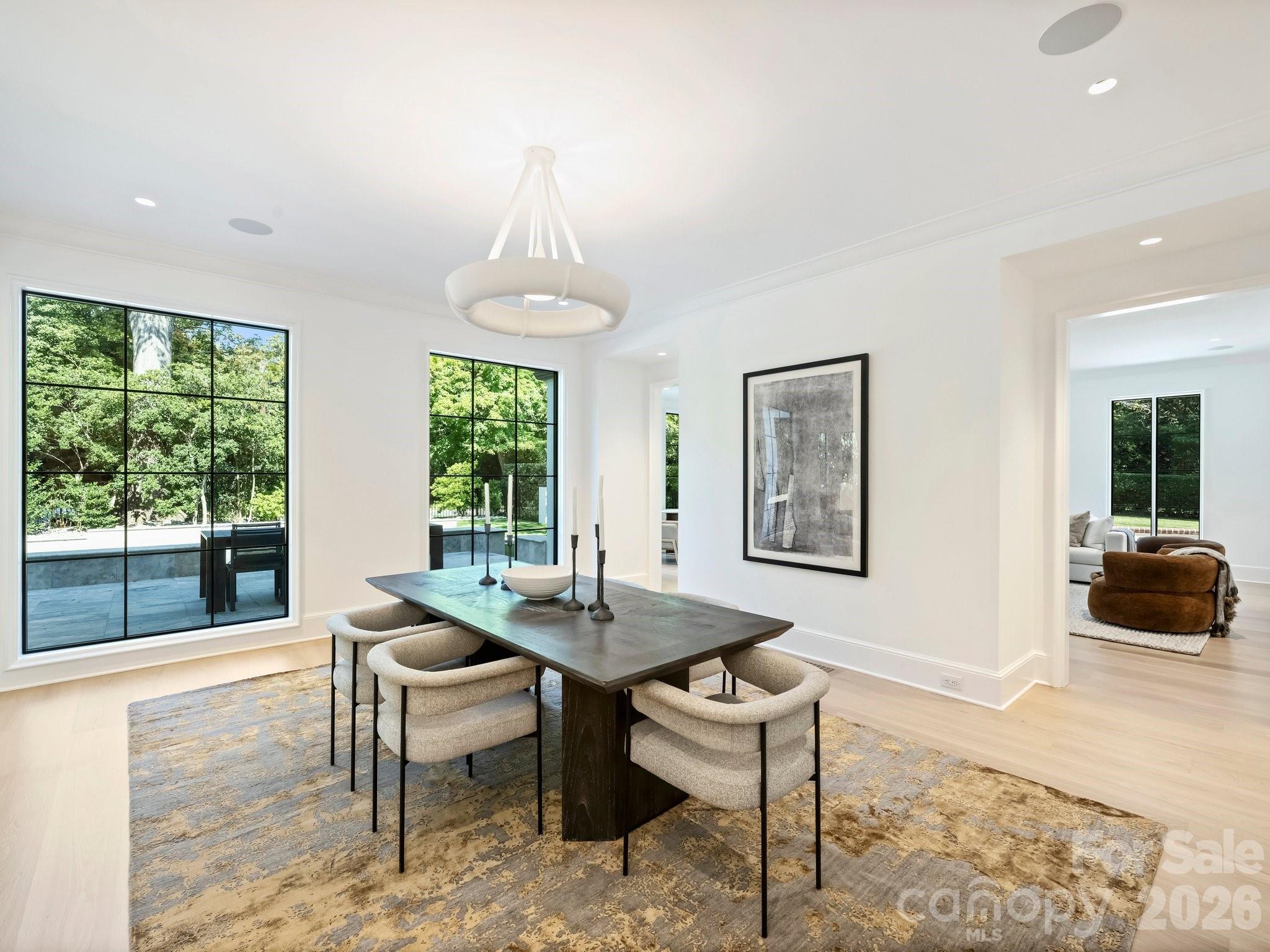 dining room overlooking outdoor pool area - 600 Hermitage Road, Charlotte