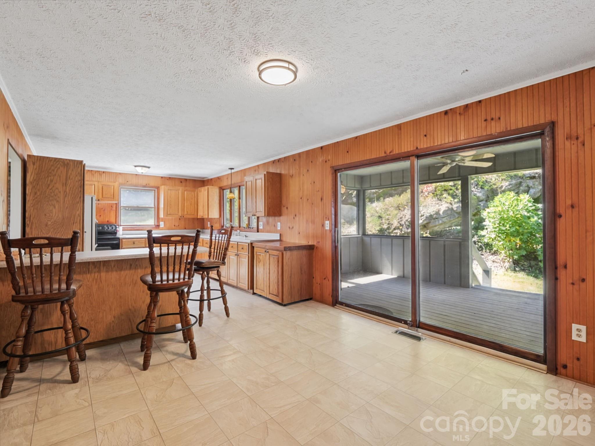 Dining room with view of screened in back porch - 727 E Lyda Road, Hendersonville
