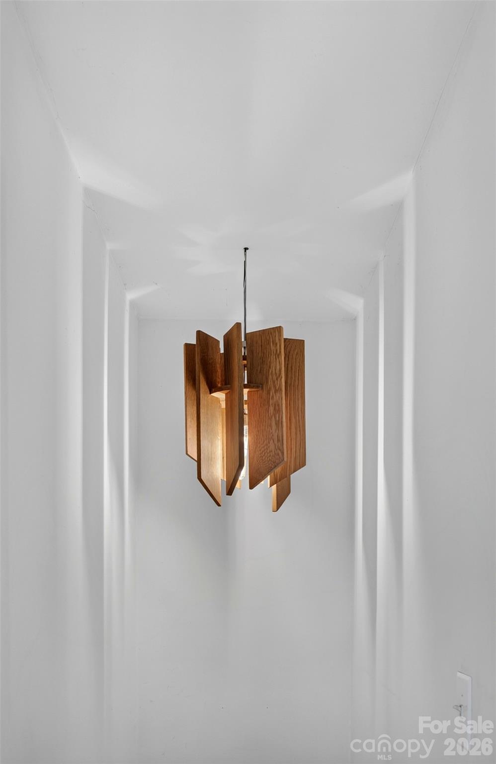 Handmade wooden lamp art in the lower level staircase - 9 Good Neighbor Ridge, Weaverville