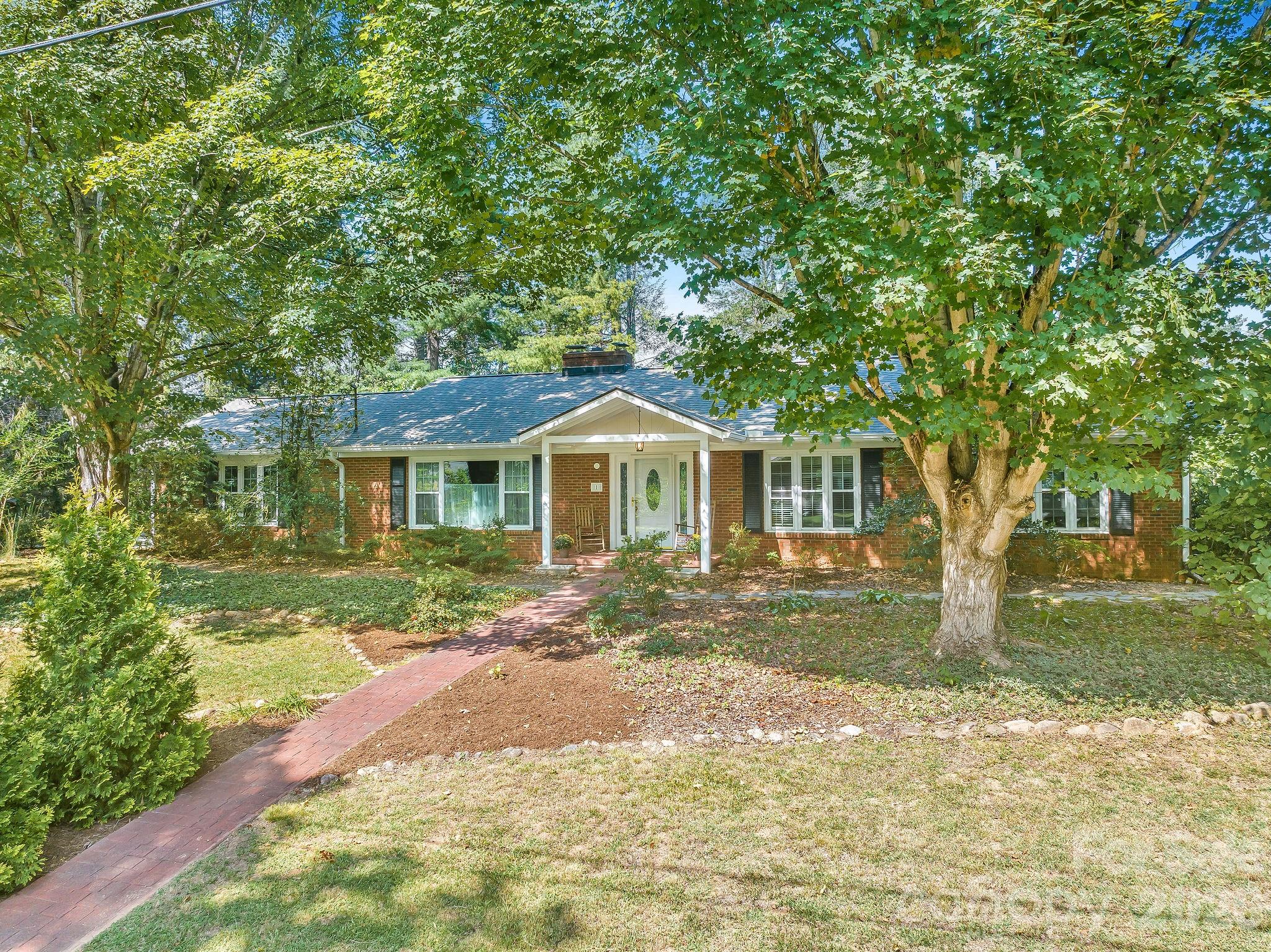 2845 sq ft house sits off the road tucked on to .5 acres. - 1 Pheasant Ridge Drive, Asheville