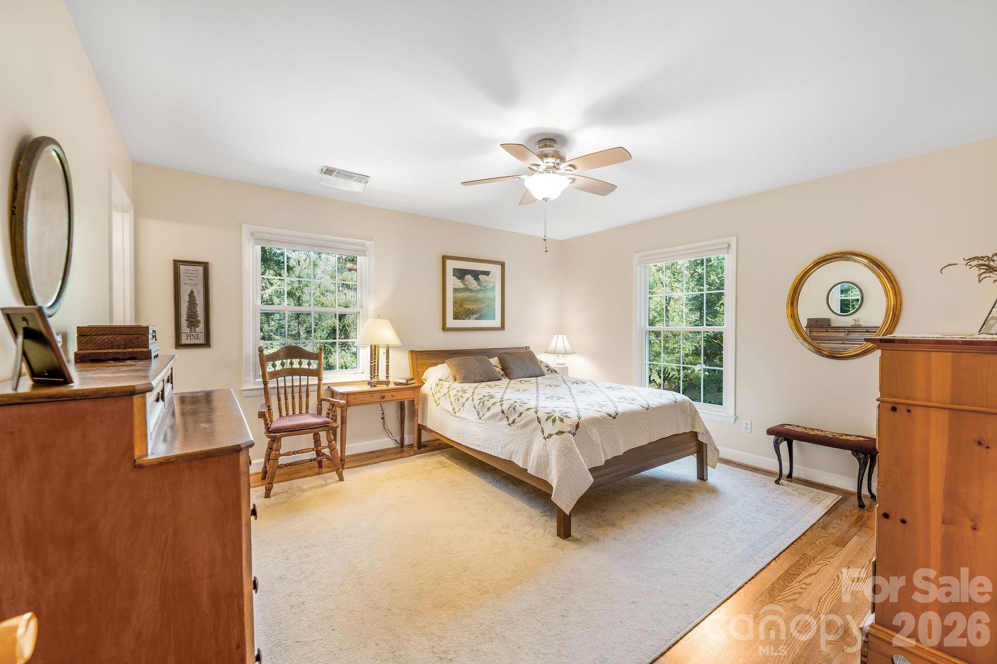 Primary bedroom equipt with full bathroom ensuite and 2 walk in closets. - 1 Pheasant Ridge Drive, Asheville