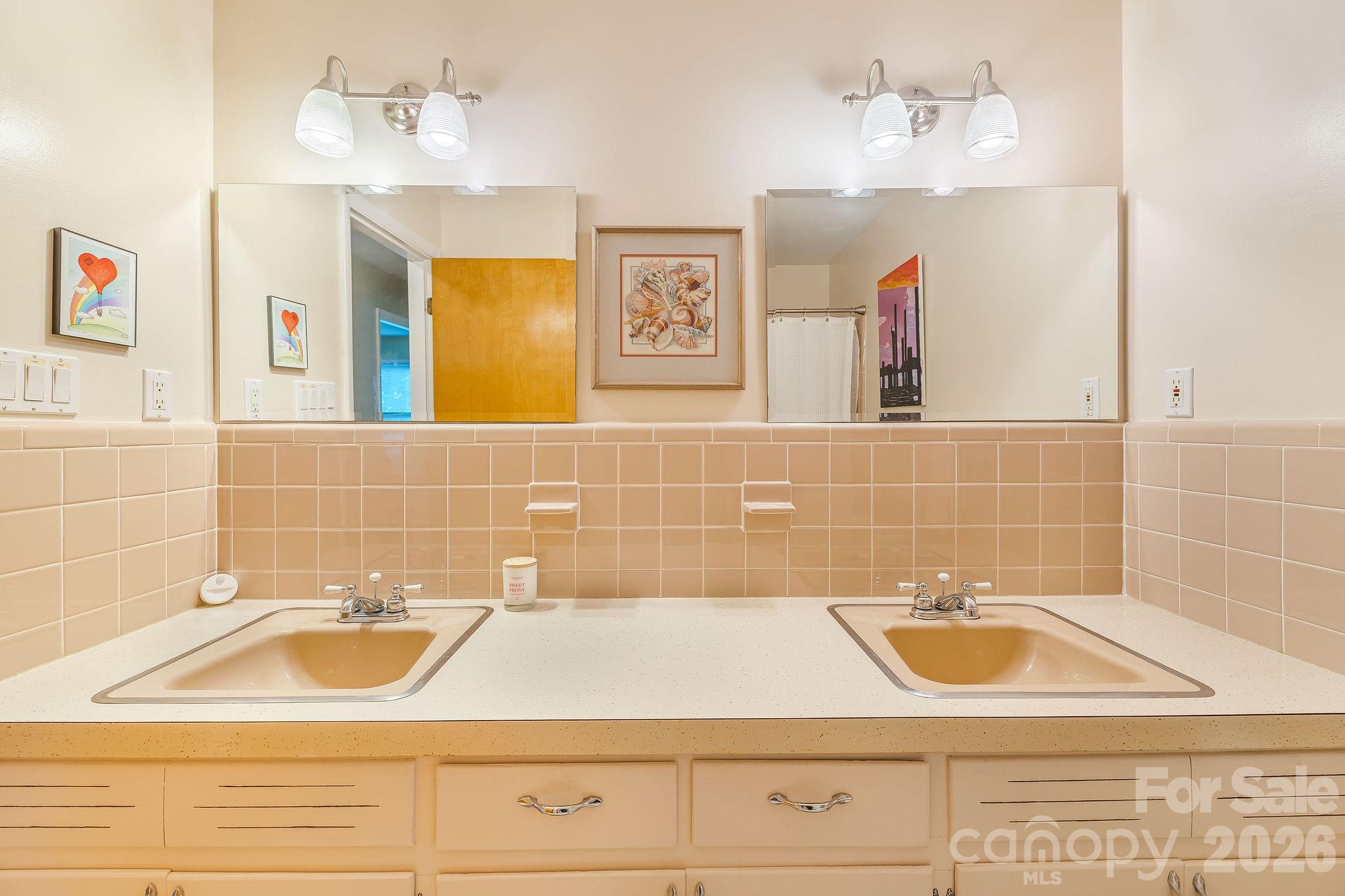 Hall bath boasts 2 sink vanity and tons of pristine mid century character. - 1 Pheasant Ridge Drive, Asheville