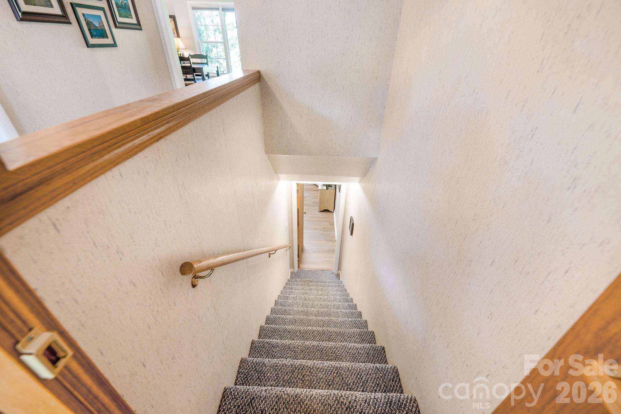 Interior stairs to lower level. - 1 Pheasant Ridge Drive, Asheville